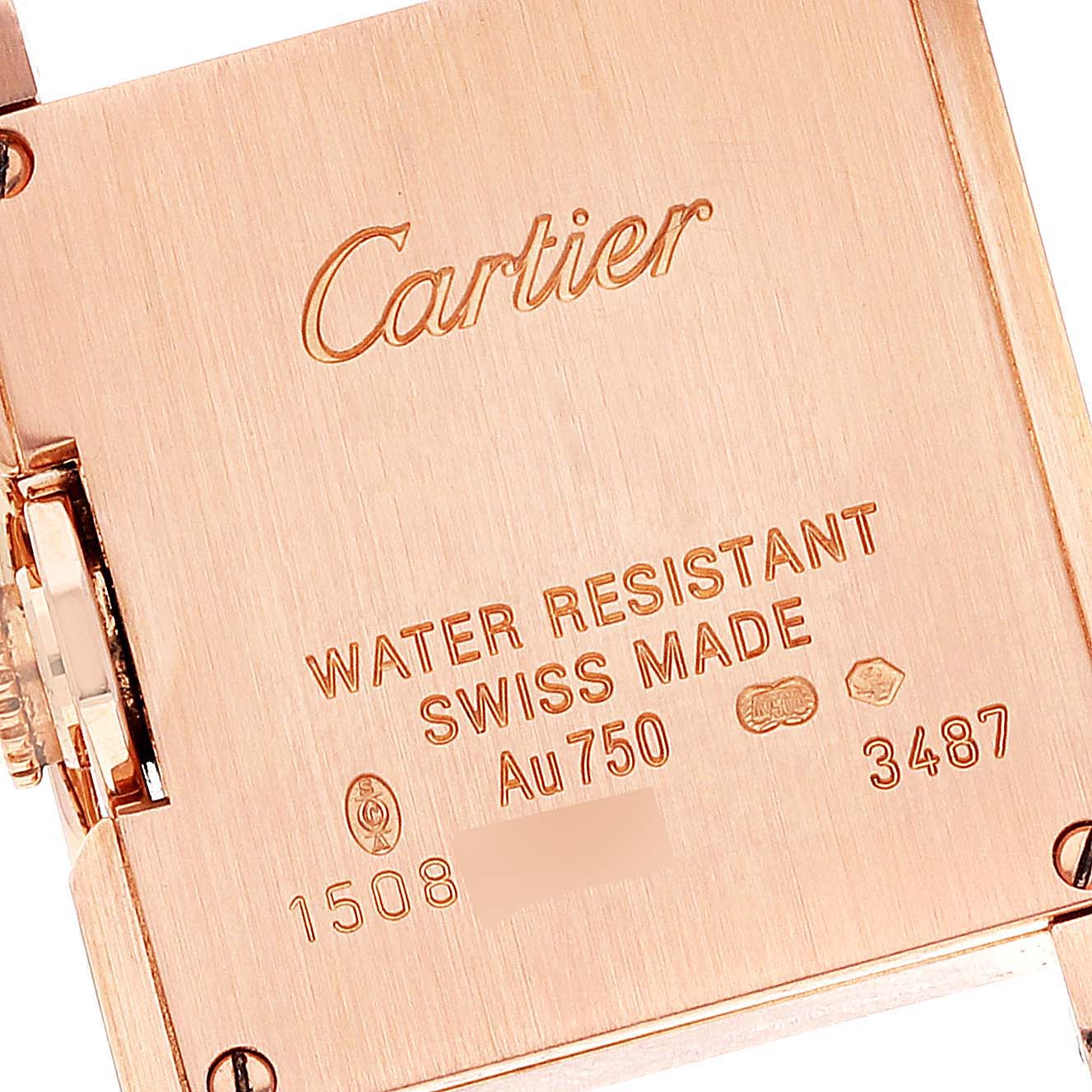 The image shows the back side of a Cartier Tank Anglaise WT100013 Women's Rose Gold Silver Dial WT100013 Women's Rose Gold Silver Dial watch, highlighting the engravings and metal markings.