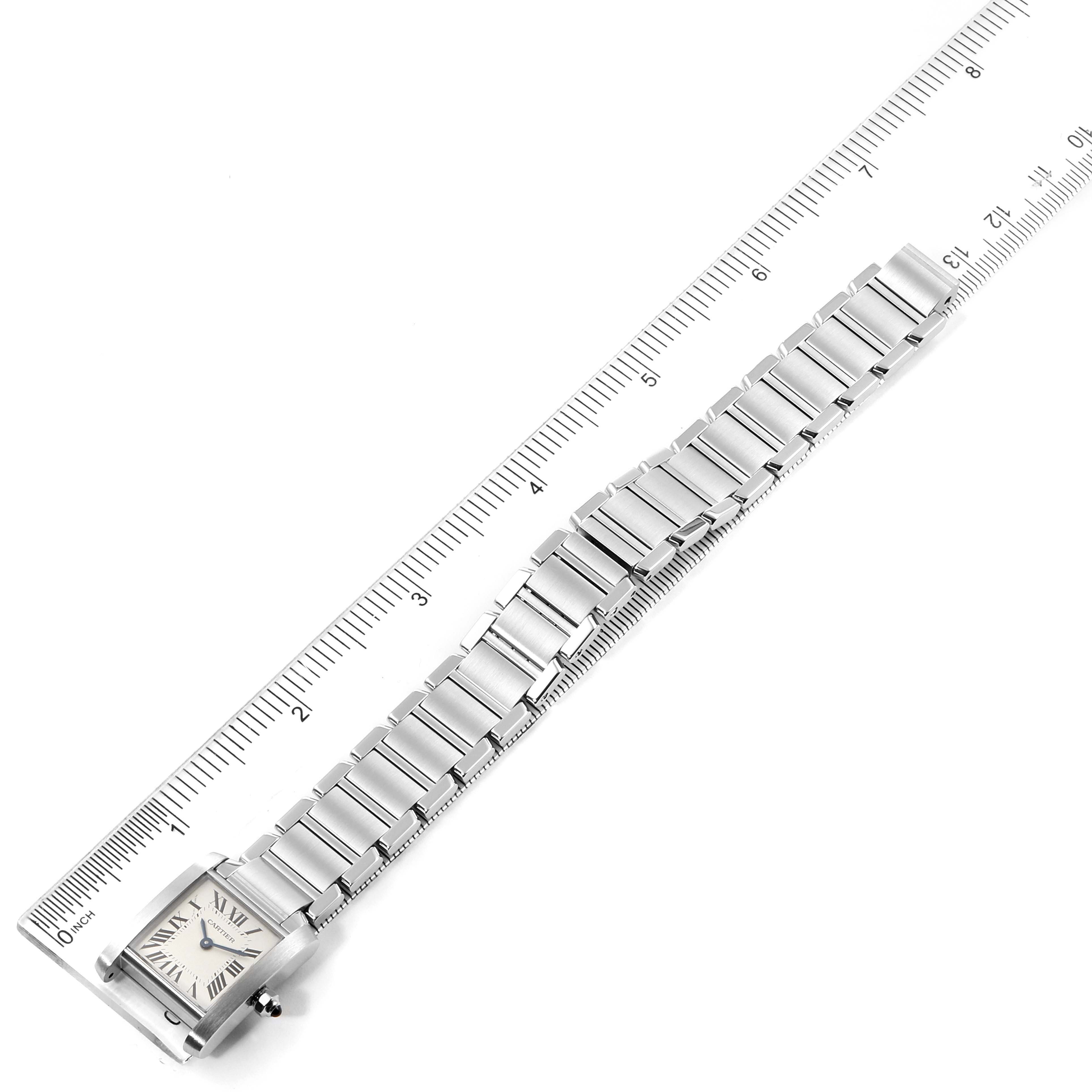 The image shows a Cartier Tank Francaise W51008Q3 Women
s Stainless Steel Silver Dial W51008Q3 Women
s Stainless Steel Silver Dial watch laid flat with a ruler for measuring the length of its stainless steel bracelet.