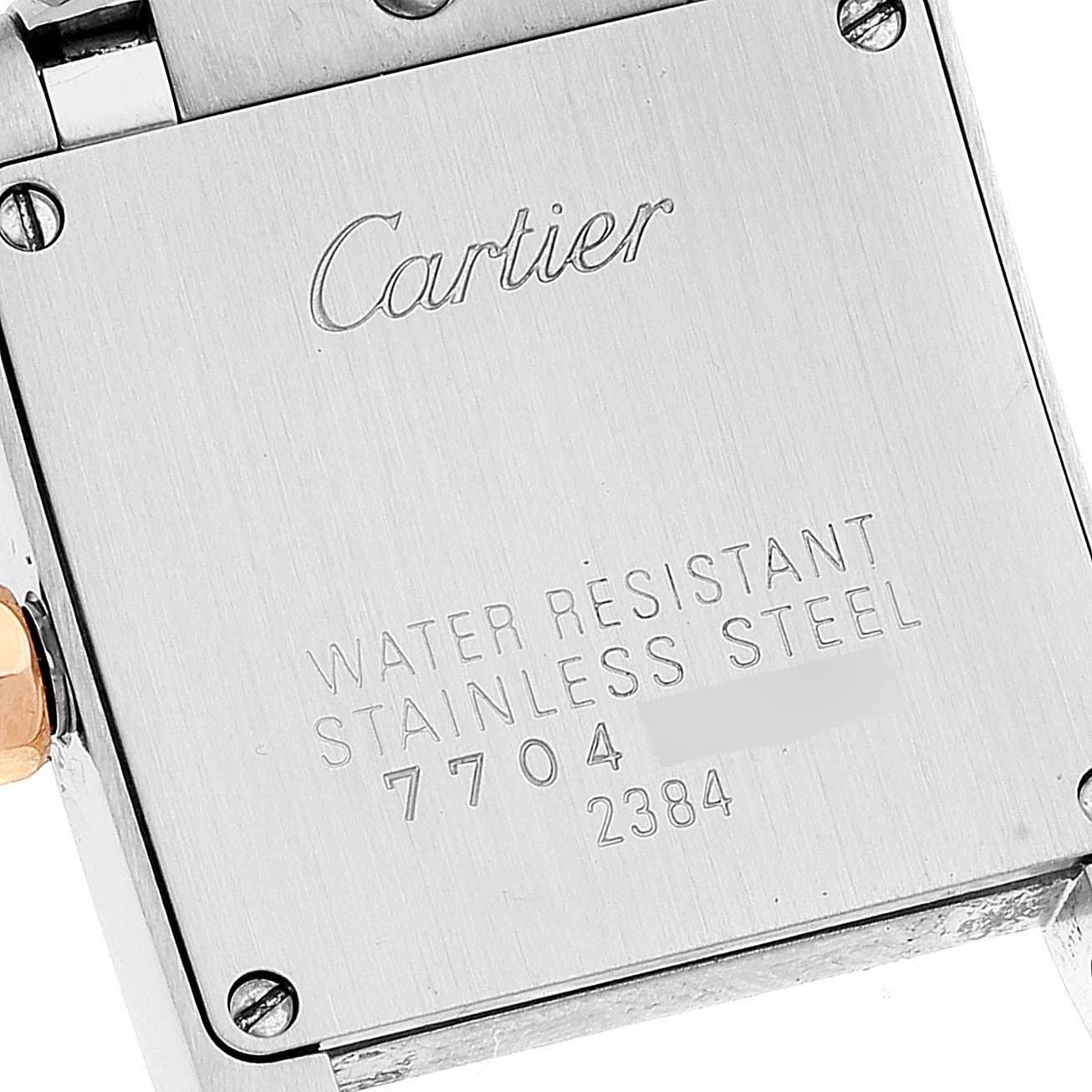 The image shows the back case of a Cartier Tank Francaise W51027Q4 Women's Steel and Gold (two tone) Mother of Pearl Dial W51027Q4 Women's Steel and Gold (two tone) Mother of Pearl Dial watch, displaying its water resistance and stainless steel properties.
