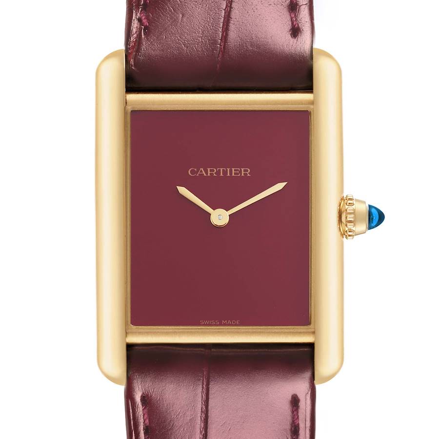 The Cartier Tank Louis watch is shown from the front, highlighting its gold case, burgundy dial, and leather strap.