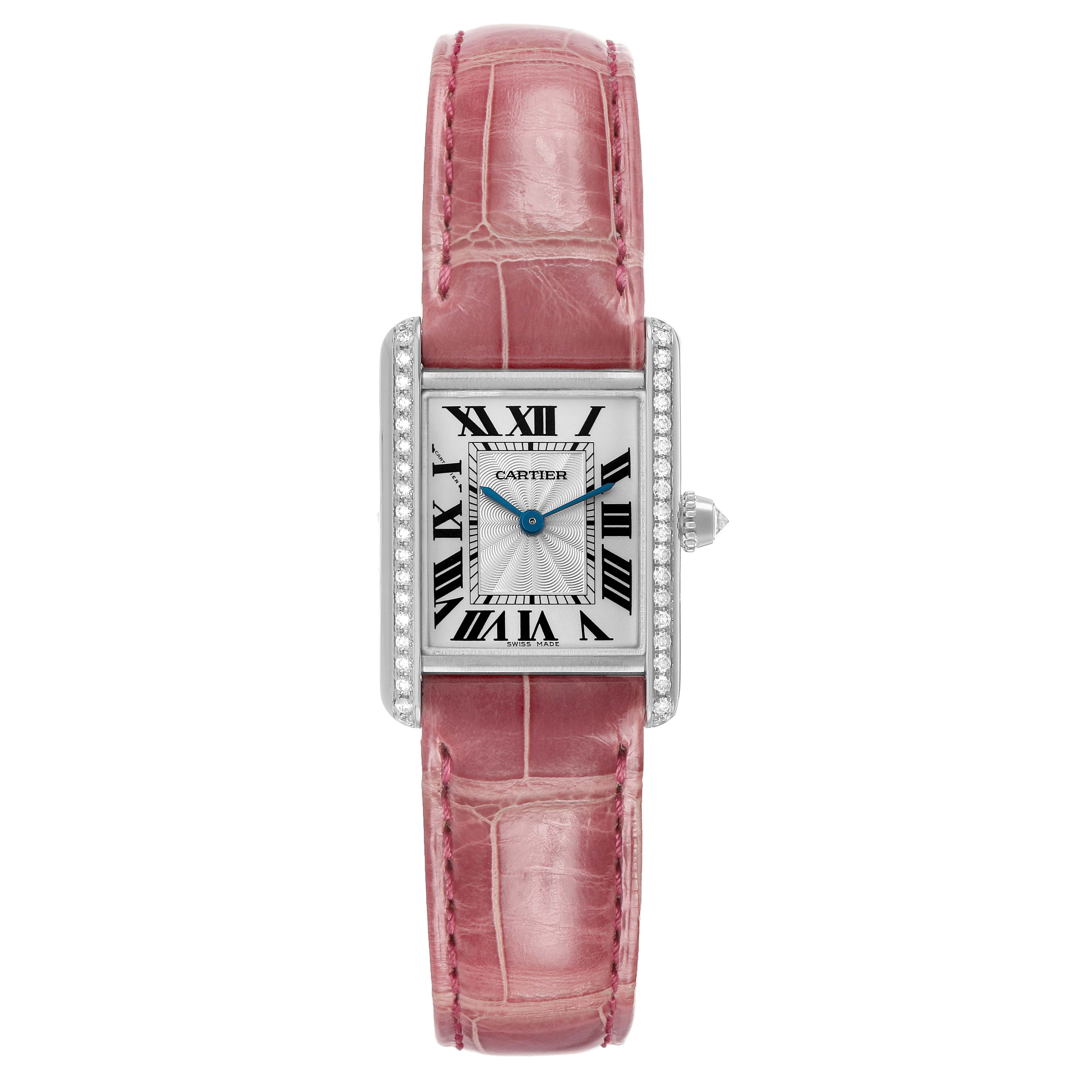 The Cartier Tank Louis WJTA0011 Women's White Gold Silver Dial watch is shown from a top-down view, highlighting its rectangular face, pink strap, and diamond detailing.