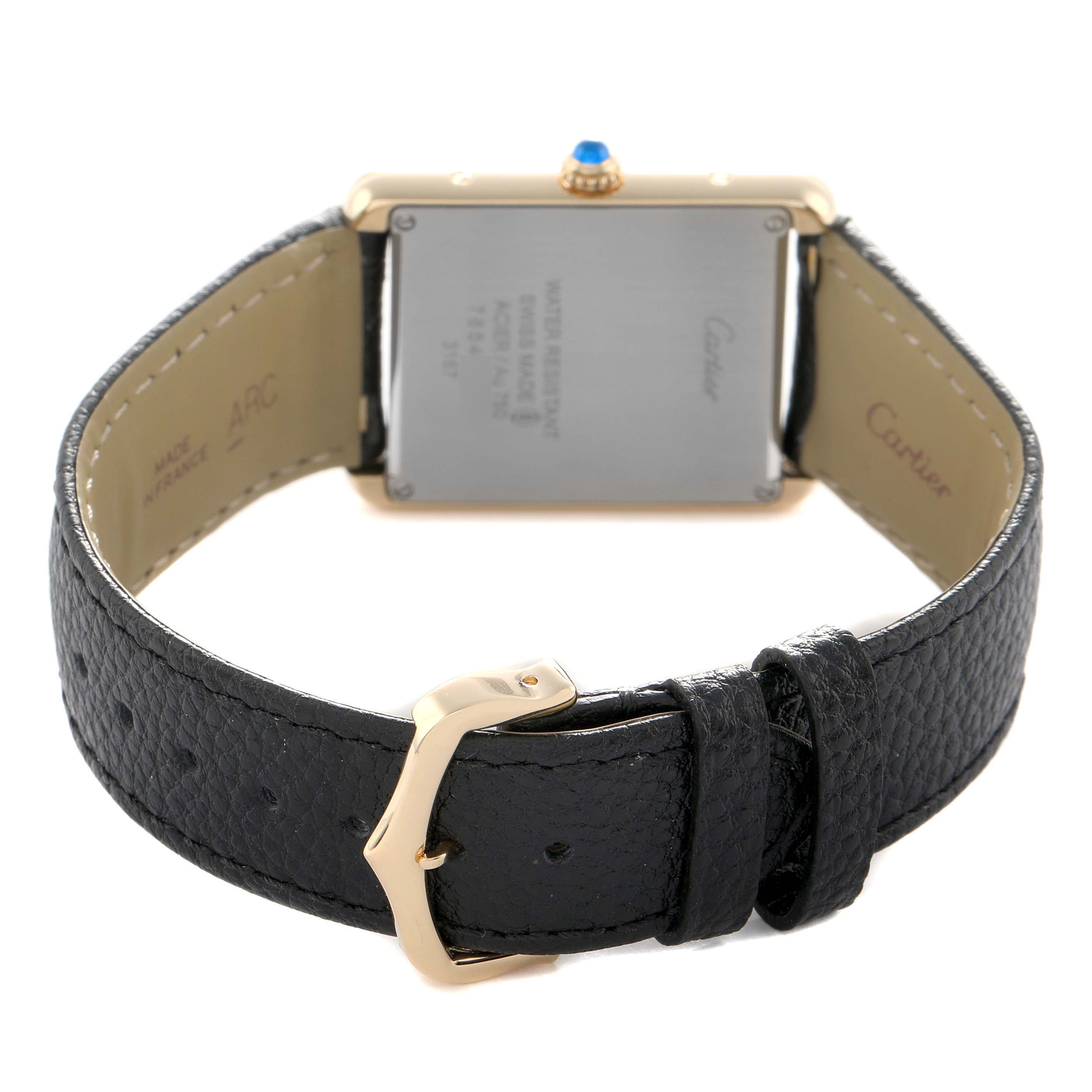 This image shows the back view of a Cartier Tank Solo W5200004 Men's Steel and Gold (two tone) Silver Dial, highlighting the case back, leather strap, and buckle.