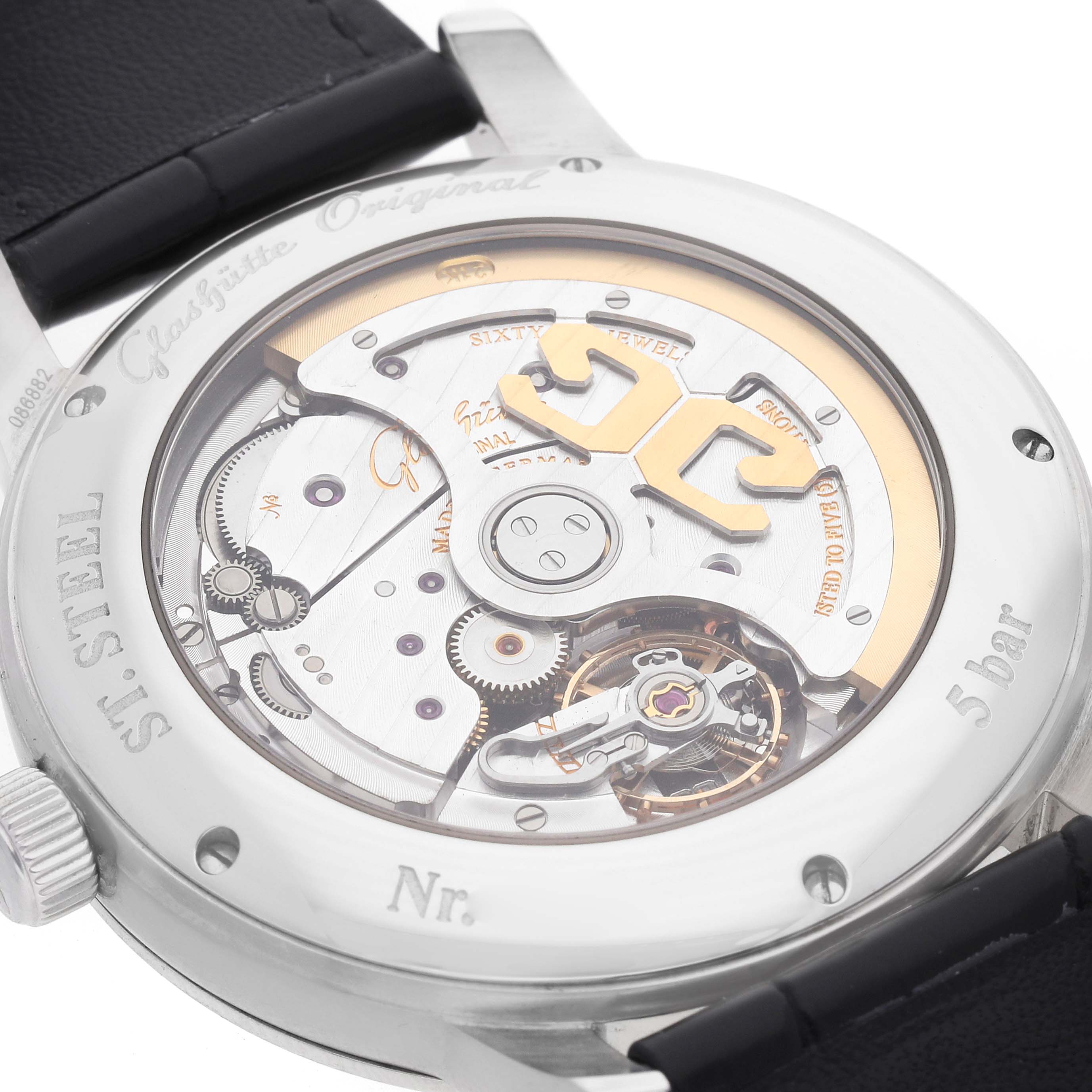 The image shows the back of the Glashütte Senator watch, highlighting its intricate movement and rotor details.
