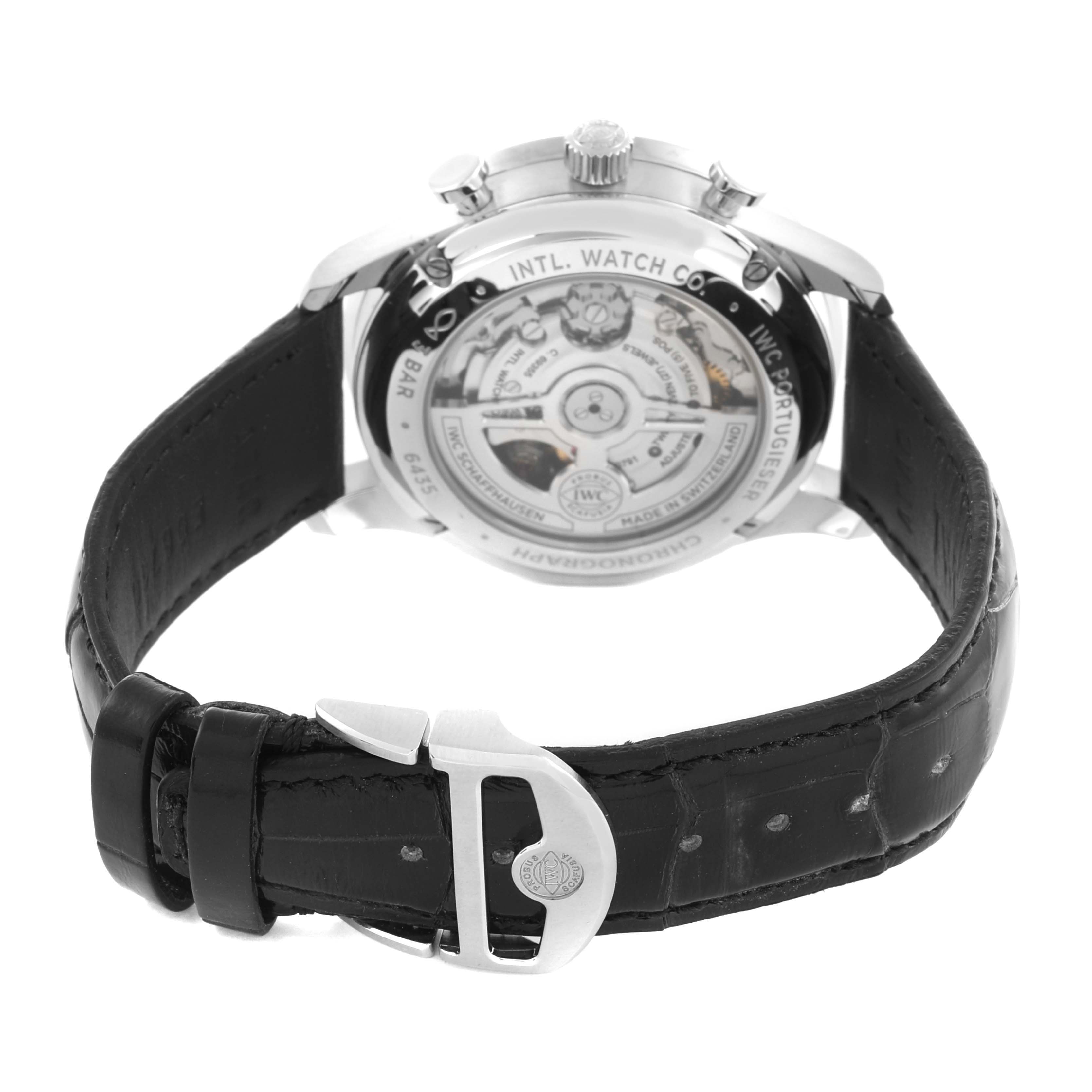 The IWC Portuguese IW371606 Men's Stainless Steel Blue Dial IW371606 Men's Stainless Steel Blue Dial watch is shown from the rear, displaying the case back and black leather strap with a buckle.