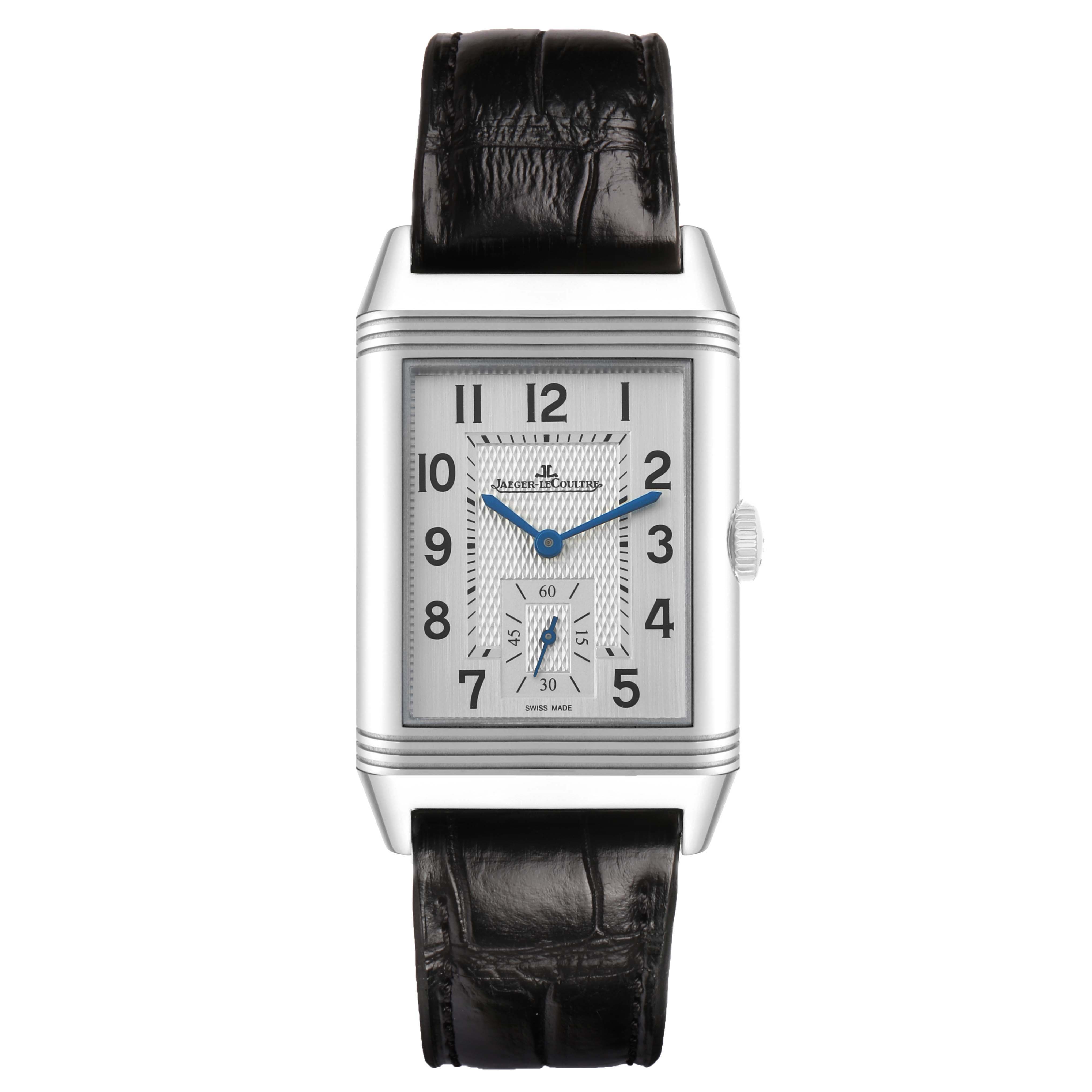 The Jaeger-LeCoultre Reverso watch is shown from the front, displaying its face, rectangular case, and black leather strap.