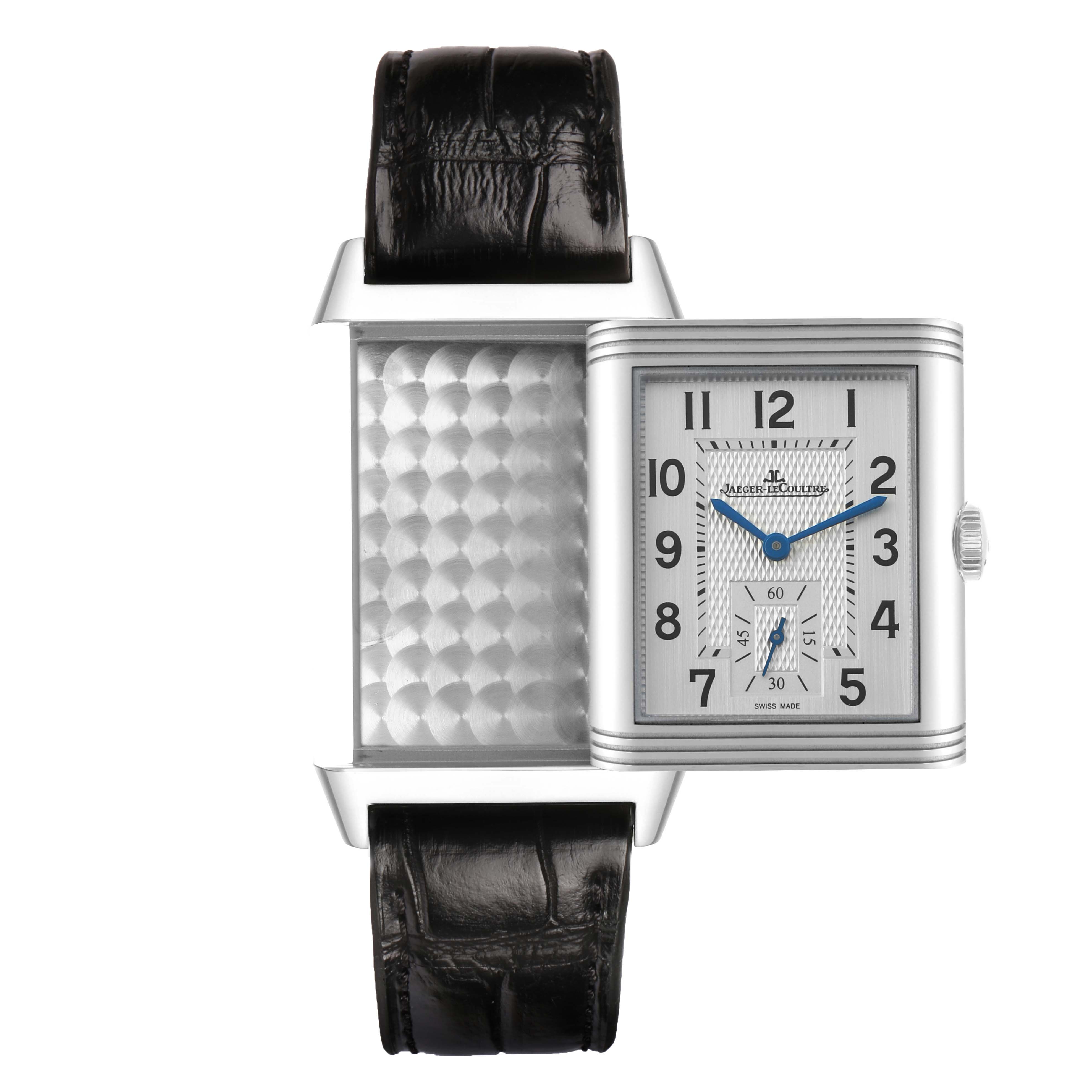 The Jaeger-LeCoultre Reverso watch is shown at a flat angle with both its face and reverse side visible.