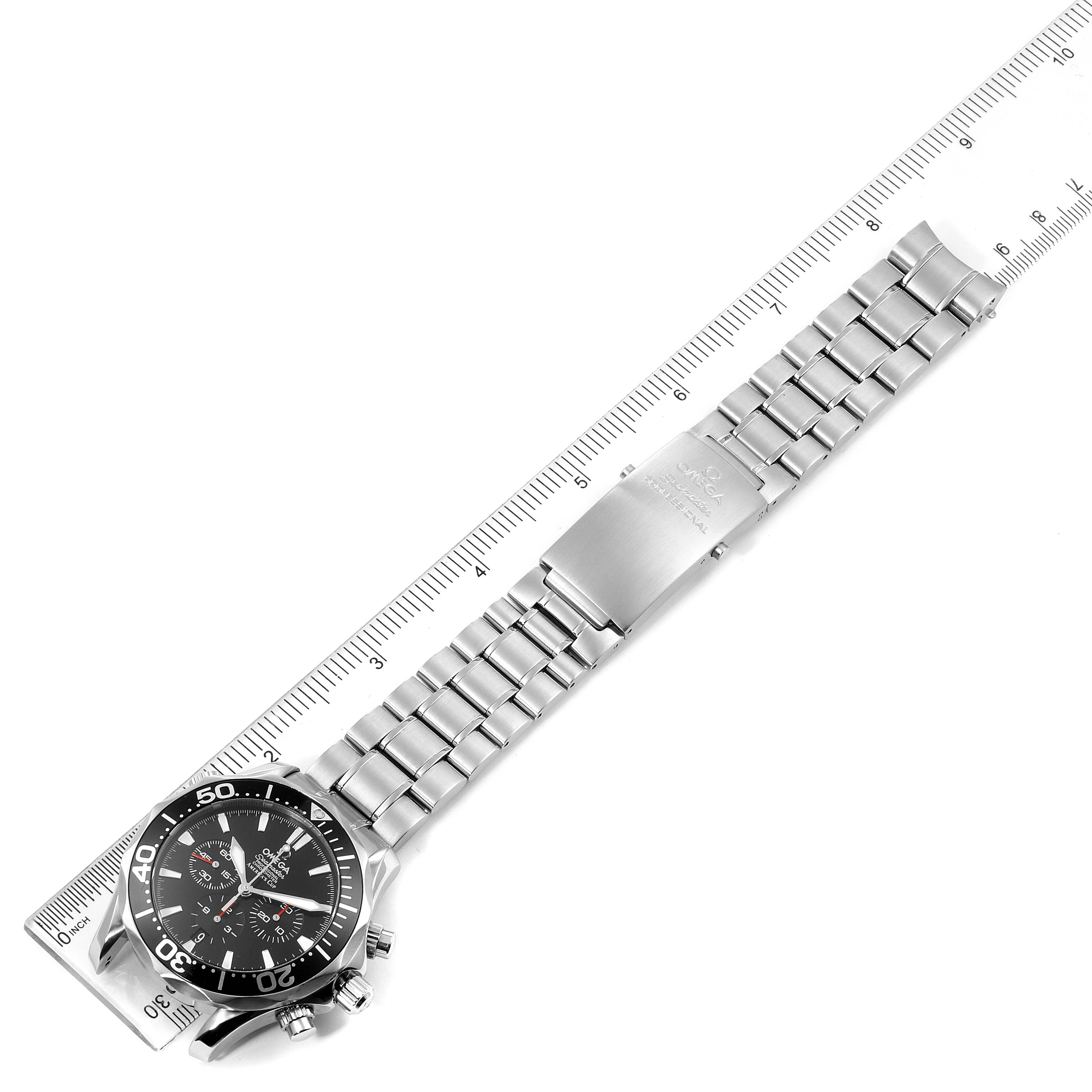 The Omega Seamaster 2594.52.00 Men
s Stainless Steel Black Dial 2594.52.00 Men
s Stainless Steel Black Dial watch is shown from an angled top view, displaying its face, metal bracelet, and clasp alongside a ruler for scale.