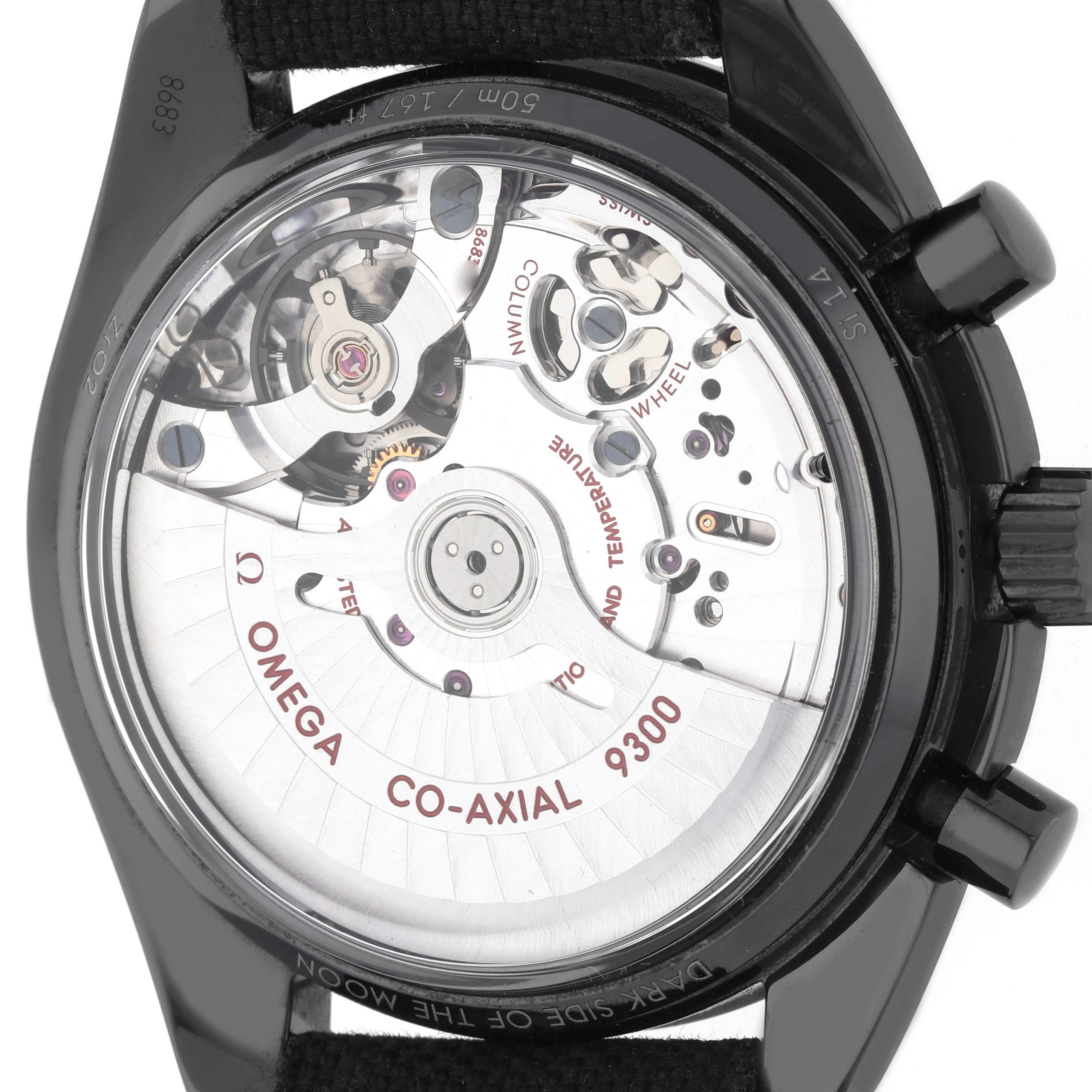The image shows the back view of an Omega Speedmaster 311.92.44.51.01.003 Men's Ceramic Black Dial, highlighting its Co-Axial 9300 movement and components.