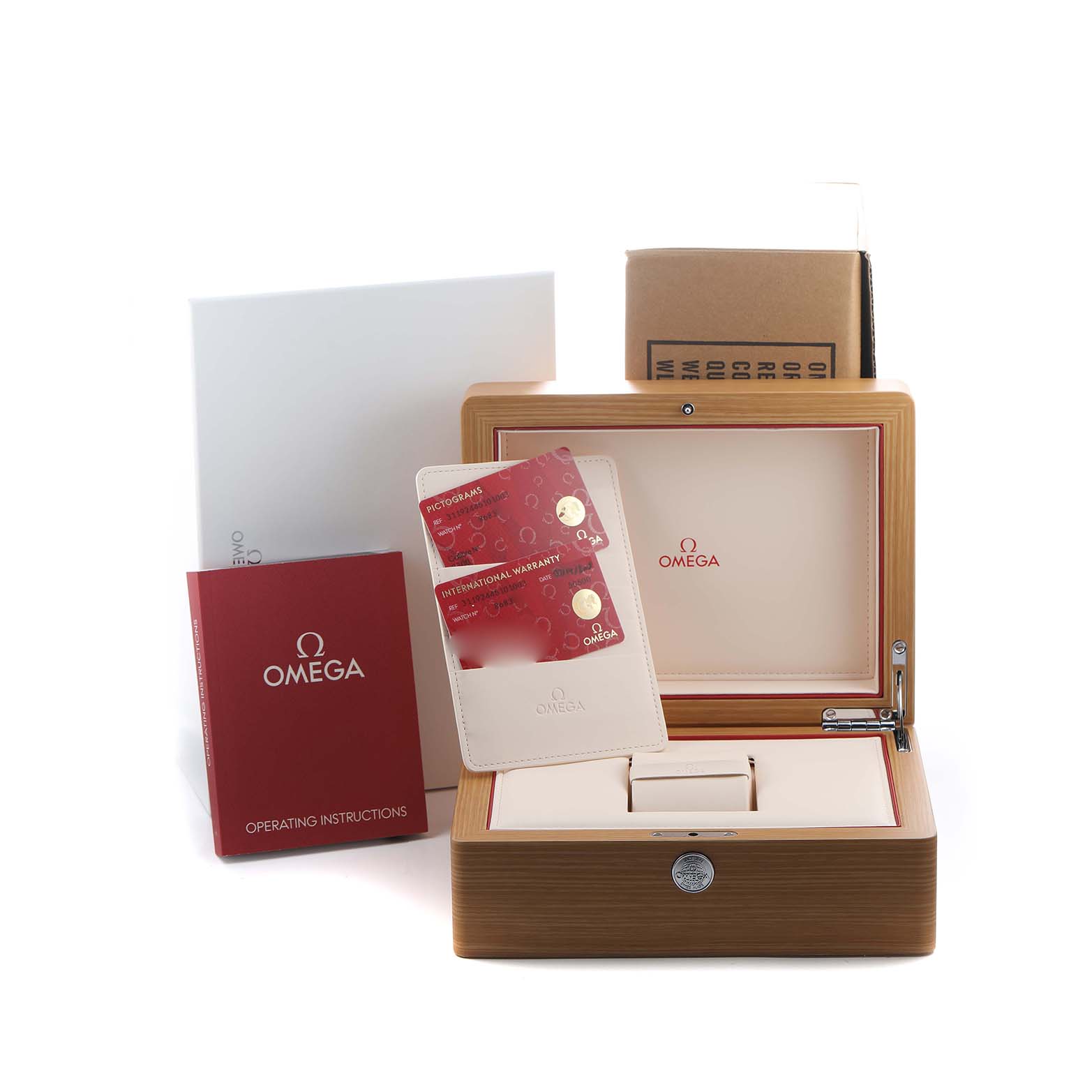 The image shows an Omega Speedmaster 311.92.44.51.01.003 Men's Ceramic Black Dial watch box, cards, and operating instructions at an angle displaying the box's interior.