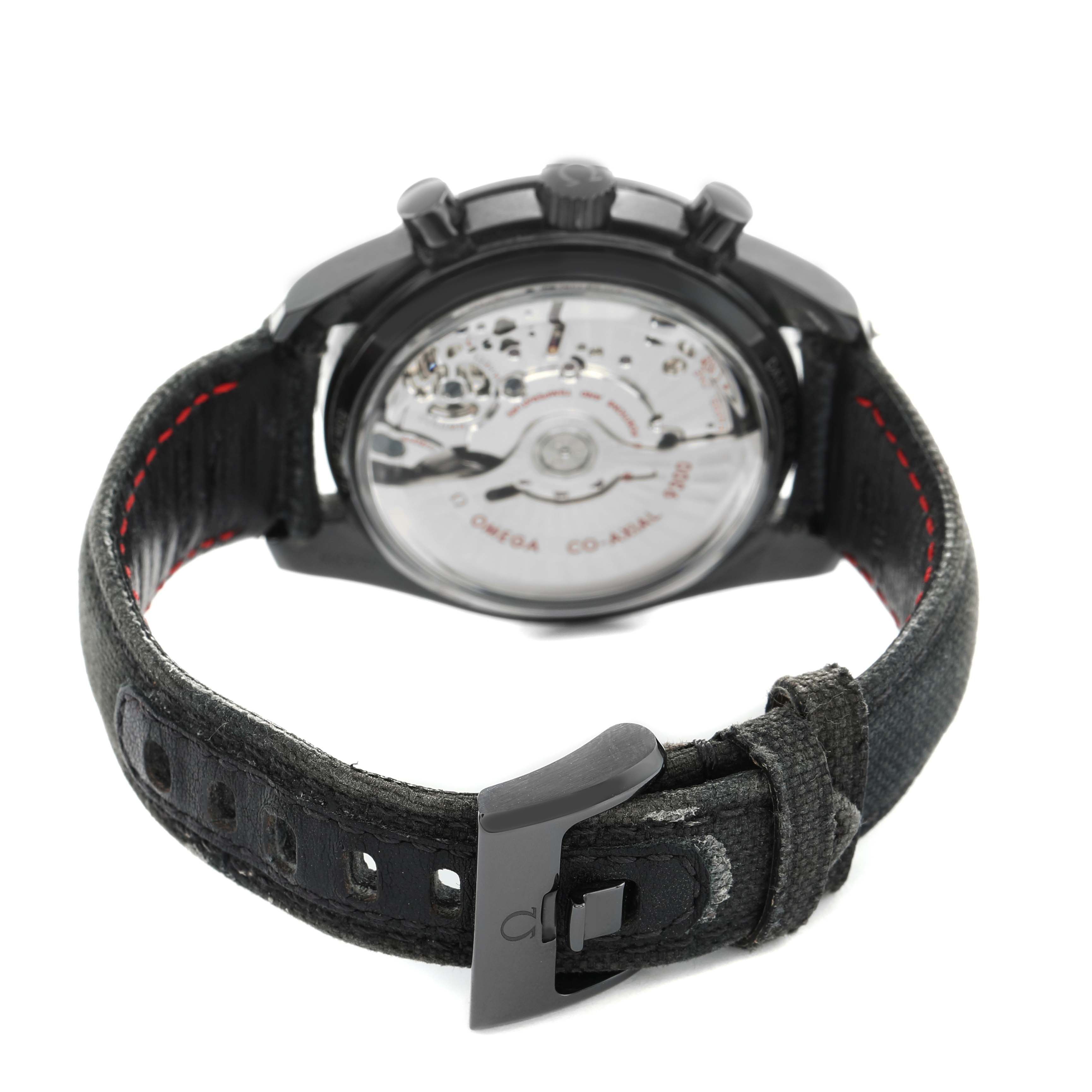 The image shows the back view of an Omega Speedmaster 311.92.44.51.01.003 Men's Ceramic Black Dial, focusing on the movement and strap.