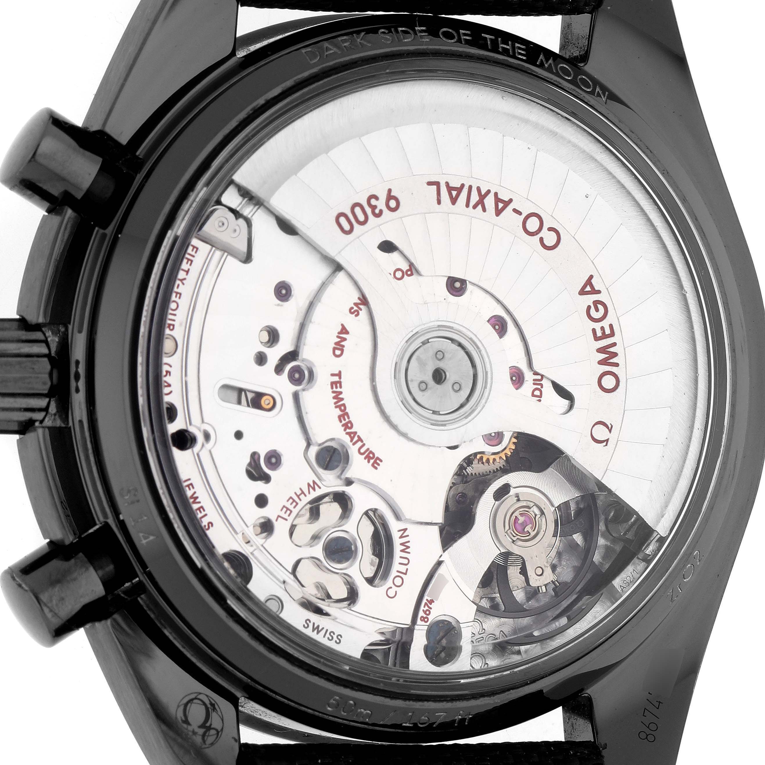 The image shows the back view of an Omega Speedmaster 311.92.44.51.01.005 Men's Ceramic Black Dial, highlighting the Co-Axial 9300 movement through a transparent case back.