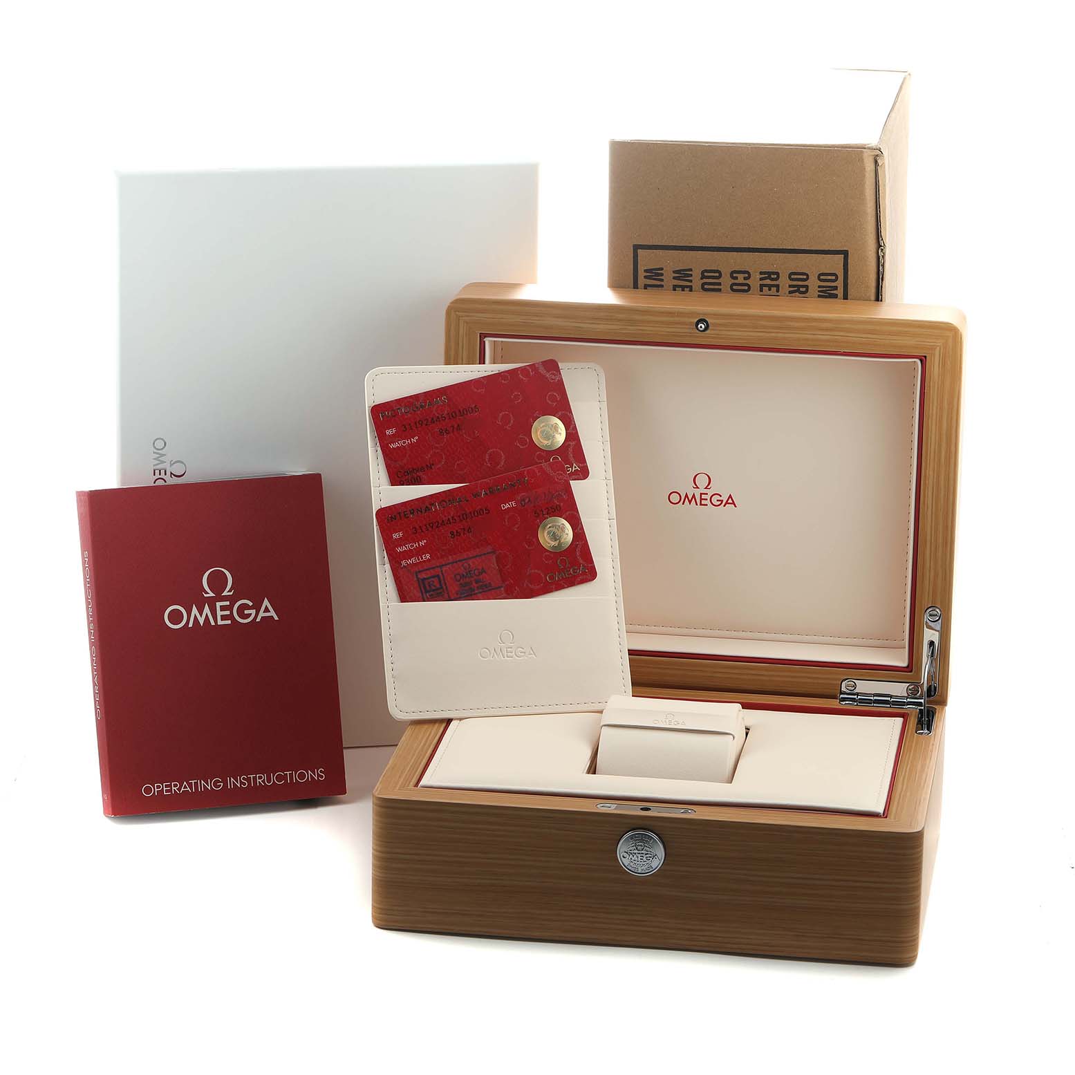 The image shows an Omega Speedmaster 311.92.44.51.01.005 Men's Ceramic Black Dial watch box with documentation, cards, and operating instructions around it.