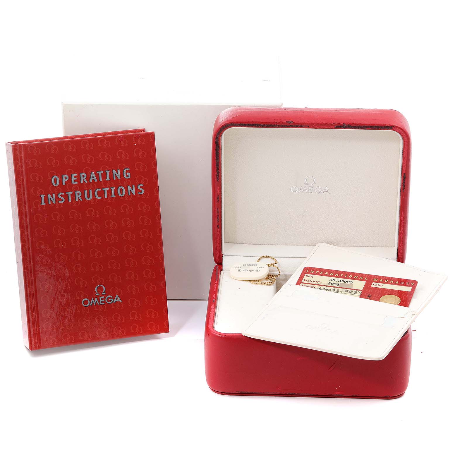 The image shows an Omega Speedmaster 3513.50.00 Men
s Stainless Steel Black Dial 3513.50.00 Men
s Stainless Steel Black Dial watch
s box, operating instructions booklet, and warranty card.