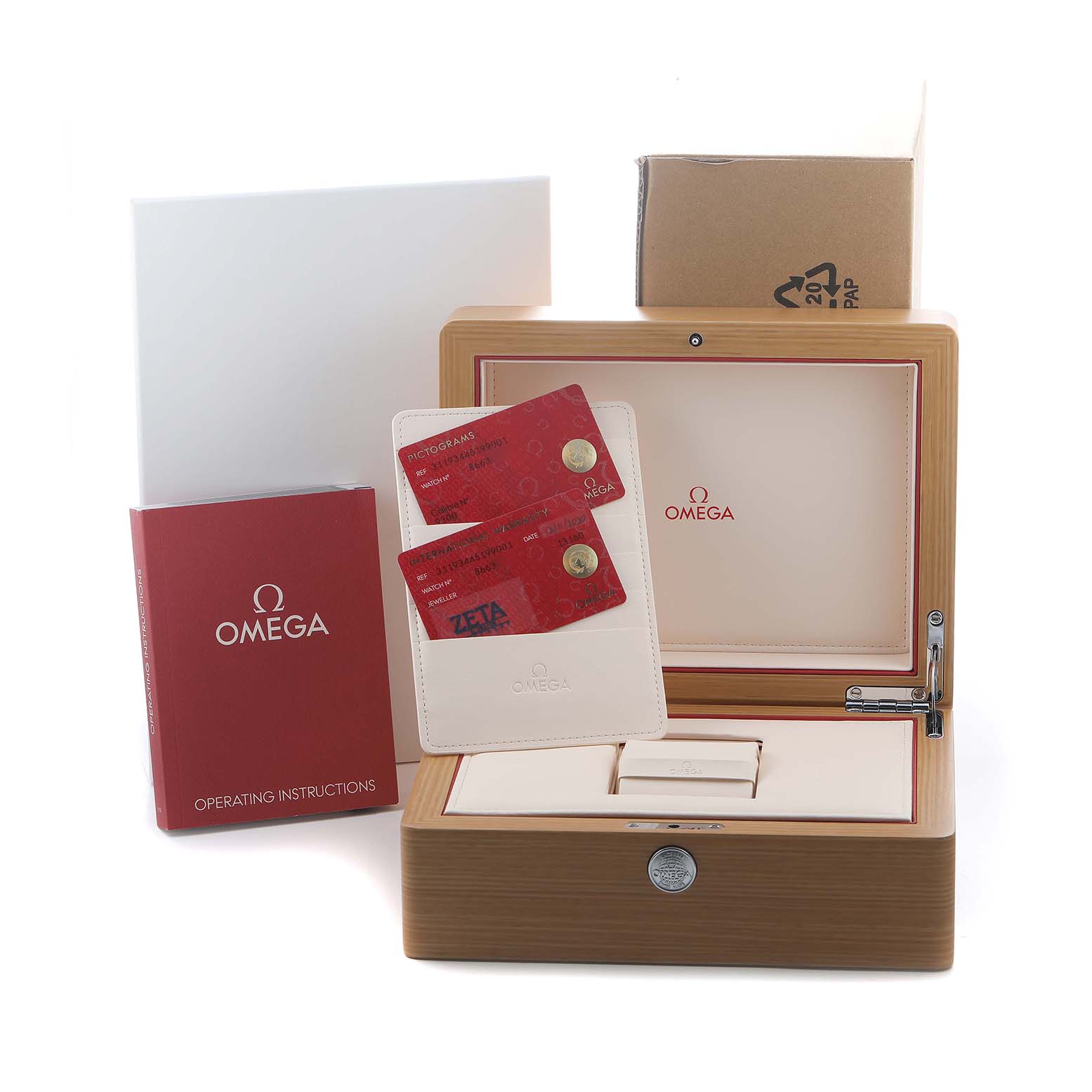 The image shows an Omega Speedmaster 311.93.44.51.99.001 Men's Ceramic Grey Dial box, operating instructions, warranty cards, and outer packaging.