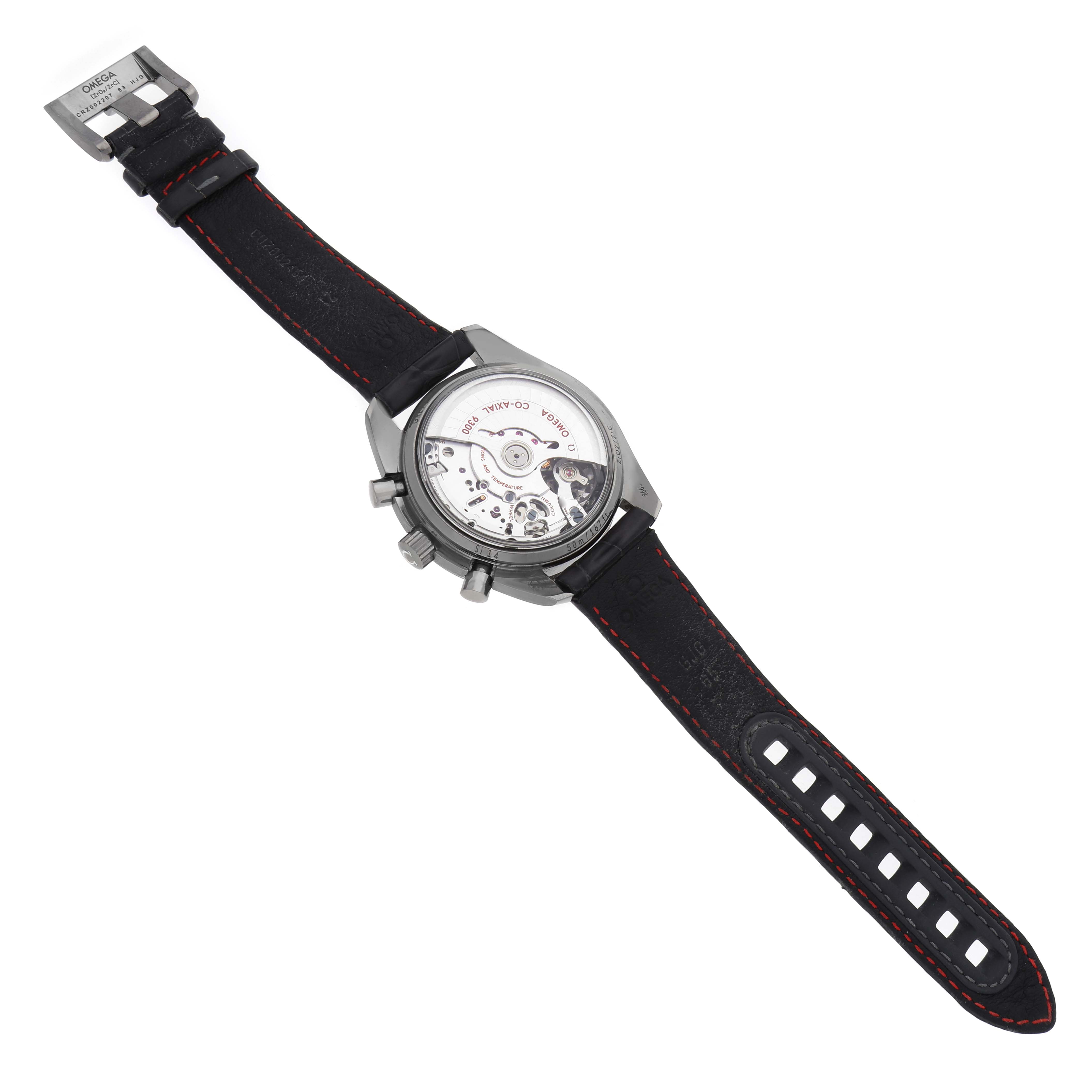 The Omega Speedmaster 311.93.44.51.99.001 Men's Ceramic Grey Dial watch is shown from the back, revealing the movement and open case back with a leather strap.