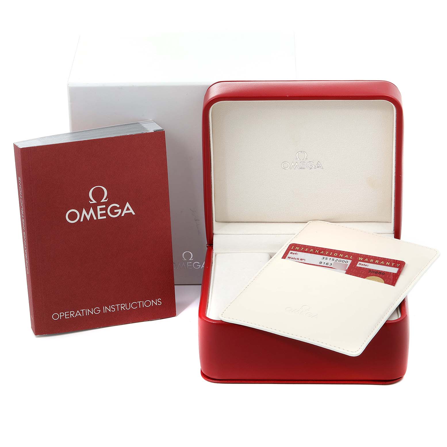 The image shows the Omega Speedmaster 3515.20.00 Men
s Stainless Steel White Dial 3515.20.00 Men
s Stainless Steel White Dial
s box, operating instructions booklet, and international warranty card holder.