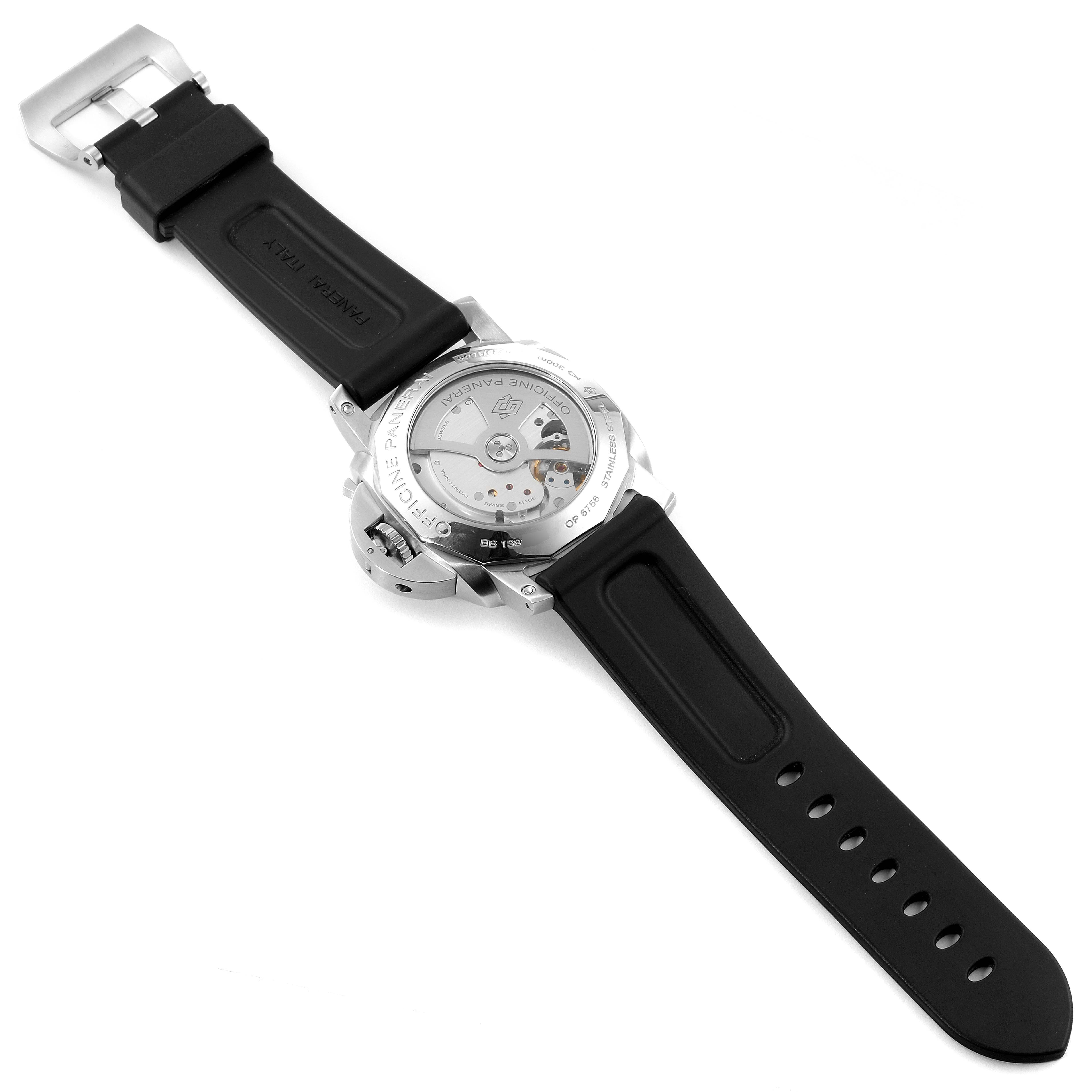 The Luminor model by Panerai is shown from the back, displaying the watch's movement and black rubber strap.