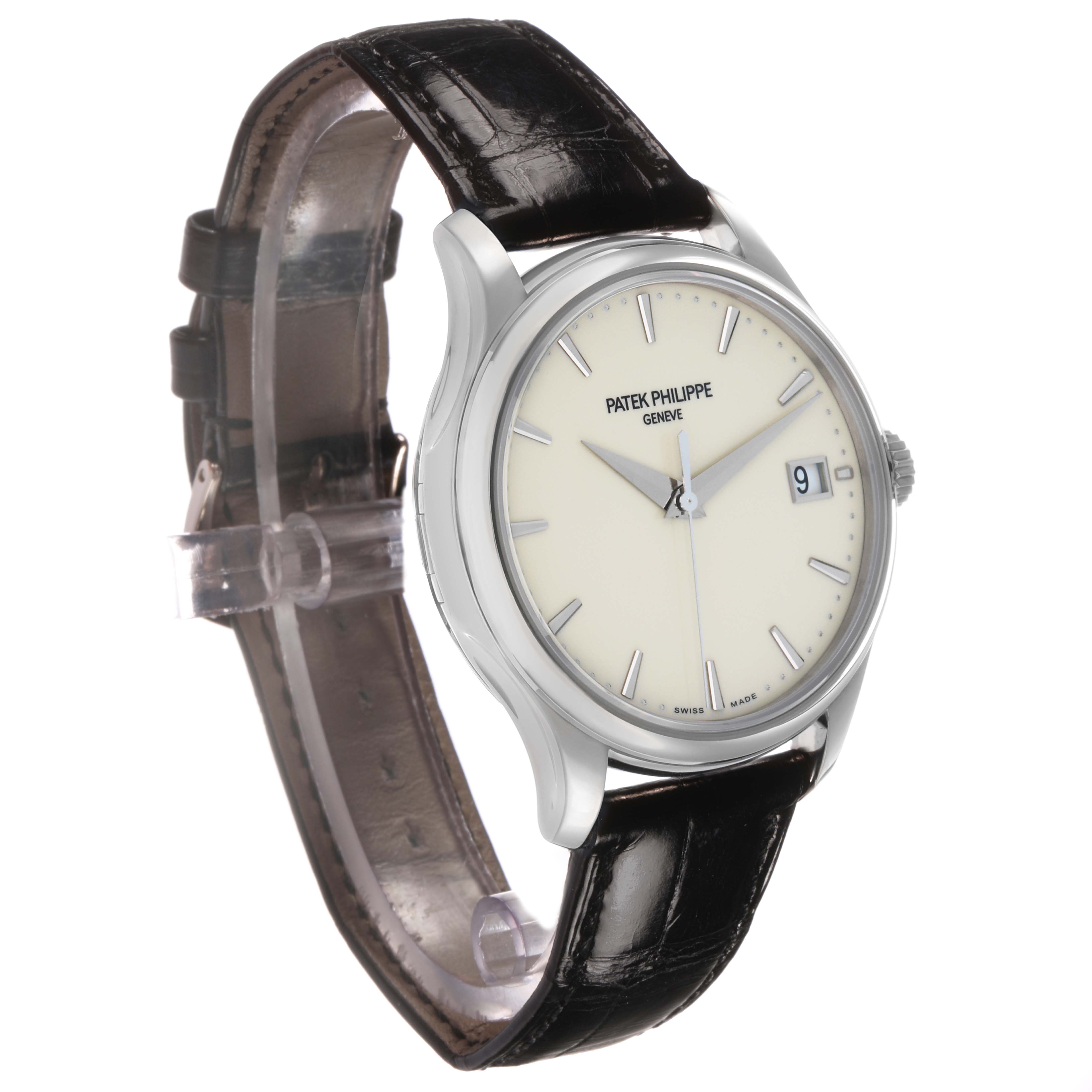 The Patek Philippe Calatrava 5227G Men's White Gold Beige Dial watch is shown at an angle highlighting its face, case, leather strap, and date display.