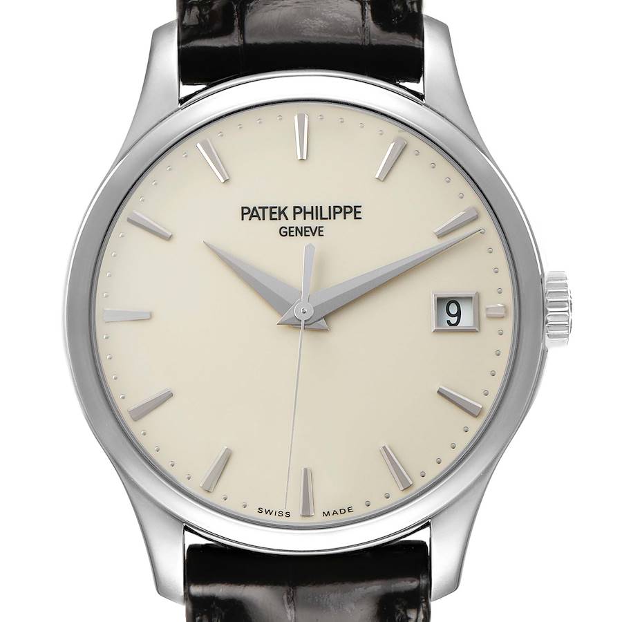 The image shows a frontal view of the Patek Philippe Calatrava 5227G Men's White Gold Beige Dial, highlighting its dial, markers, and crown.