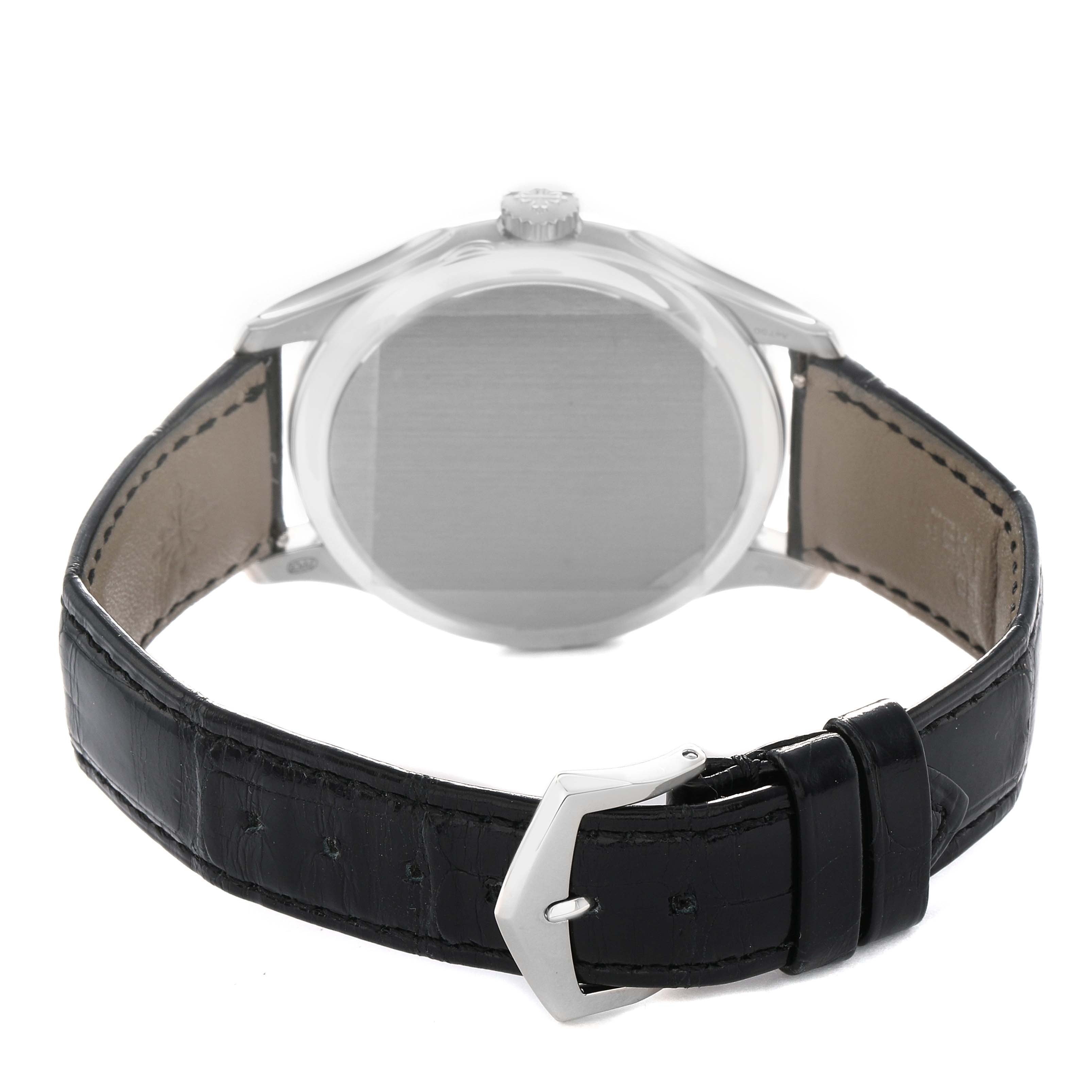 The image shows the back and side profile of a Patek Philippe Calatrava 5227G Men's White Gold Beige Dial watch, highlighting the leather strap and buckle.