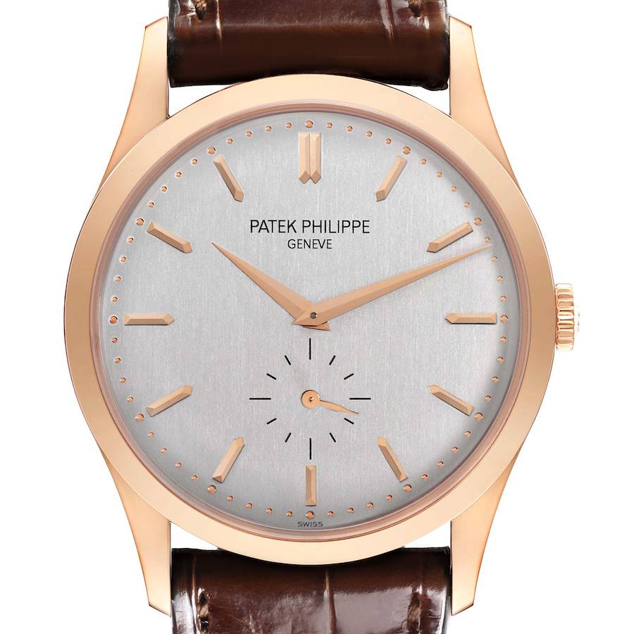 The Patek Philippe Calatrava watch is shown from the front, displaying the dial, hands, and part of the strap.