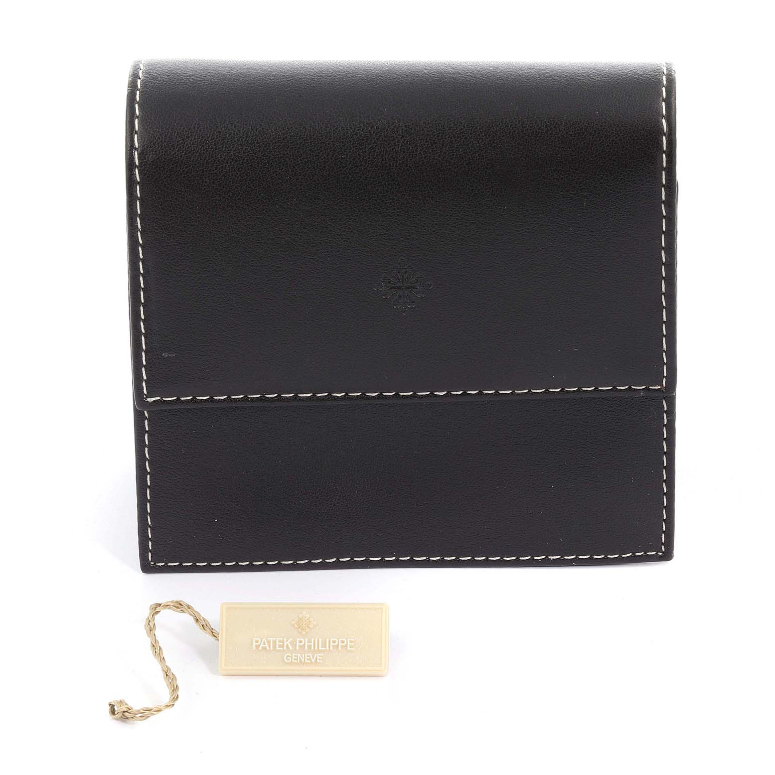 The image shows a Patek Philippe Calatrava 5196R-001 Men
s Rose Gold Silver Dial 5196R-001 Men
s Rose Gold Silver Dial leather case with a branded tag, viewed from the front.