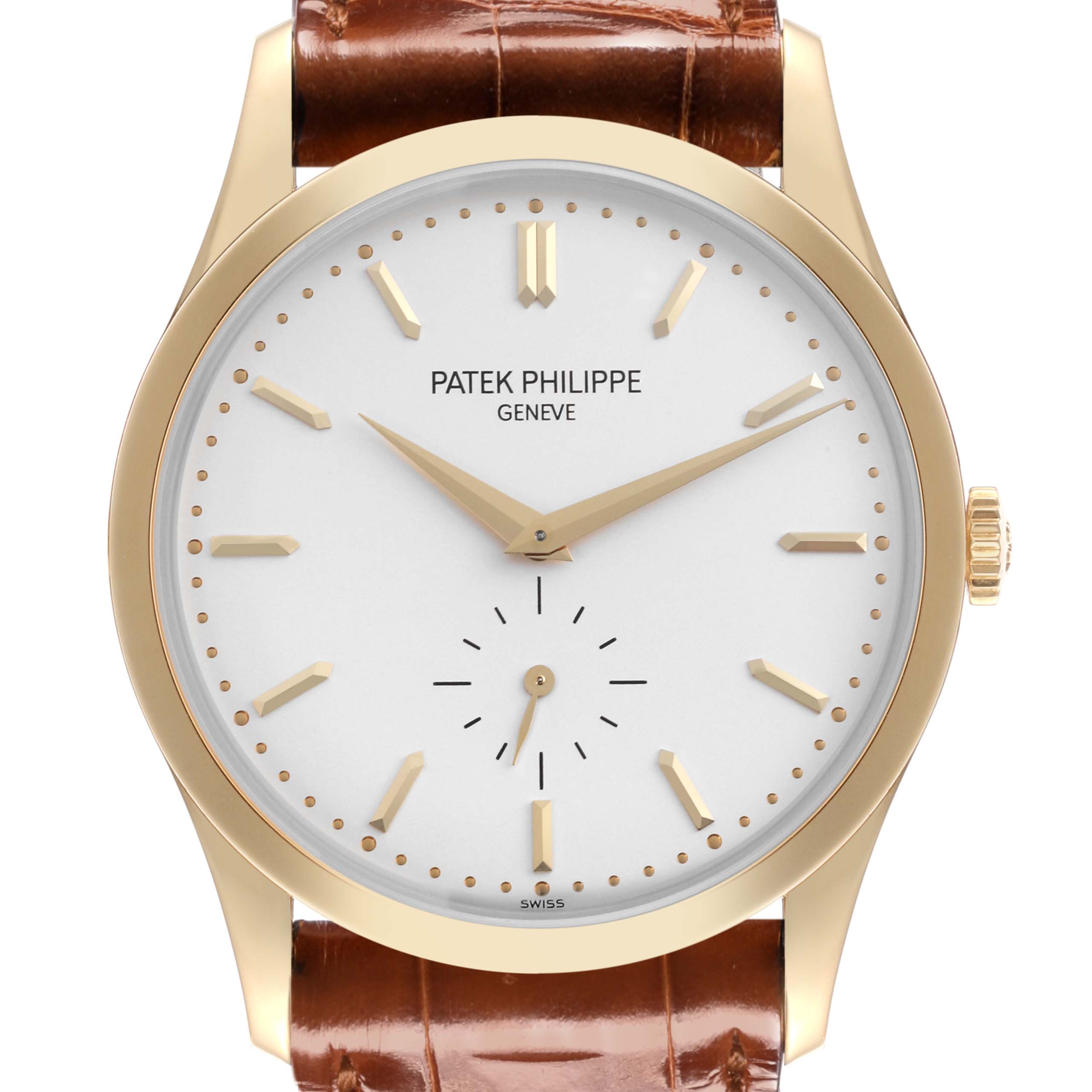 The Patek Philippe Calatrava 5196J Men's Yellow Gold Silver Dial 5196J Men's Yellow Gold Silver Dial watch is shown from a front angle, displaying the face, hands, markers, and part of the leather strap.