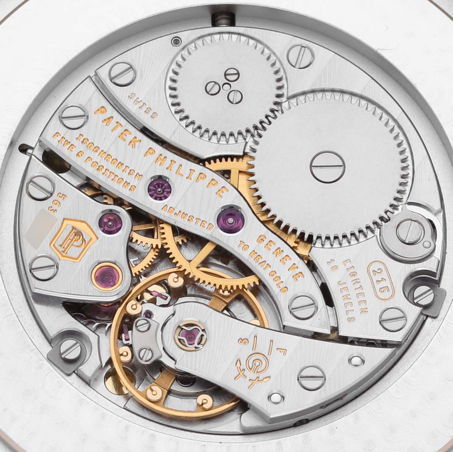 The image shows the intricate movement components of a Patek Philippe Calatrava 5196J Men's Yellow Gold Silver Dial 5196J Men's Yellow Gold Silver Dial watch from the back.