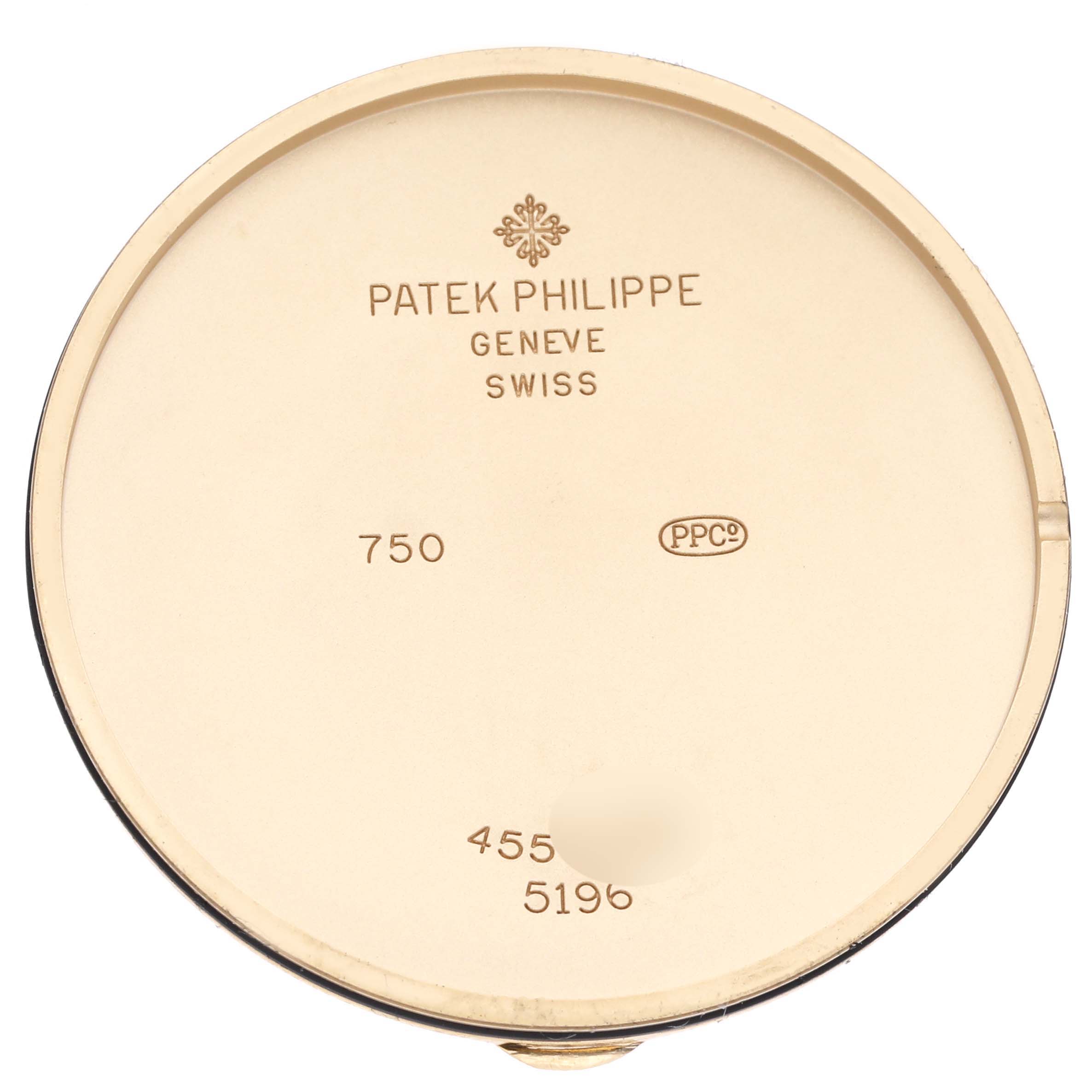 The image shows the back cover of a Patek Philippe Calatrava 5196J Men's Yellow Gold Silver Dial 5196J Men's Yellow Gold Silver Dial watch, highlighting its engravings.