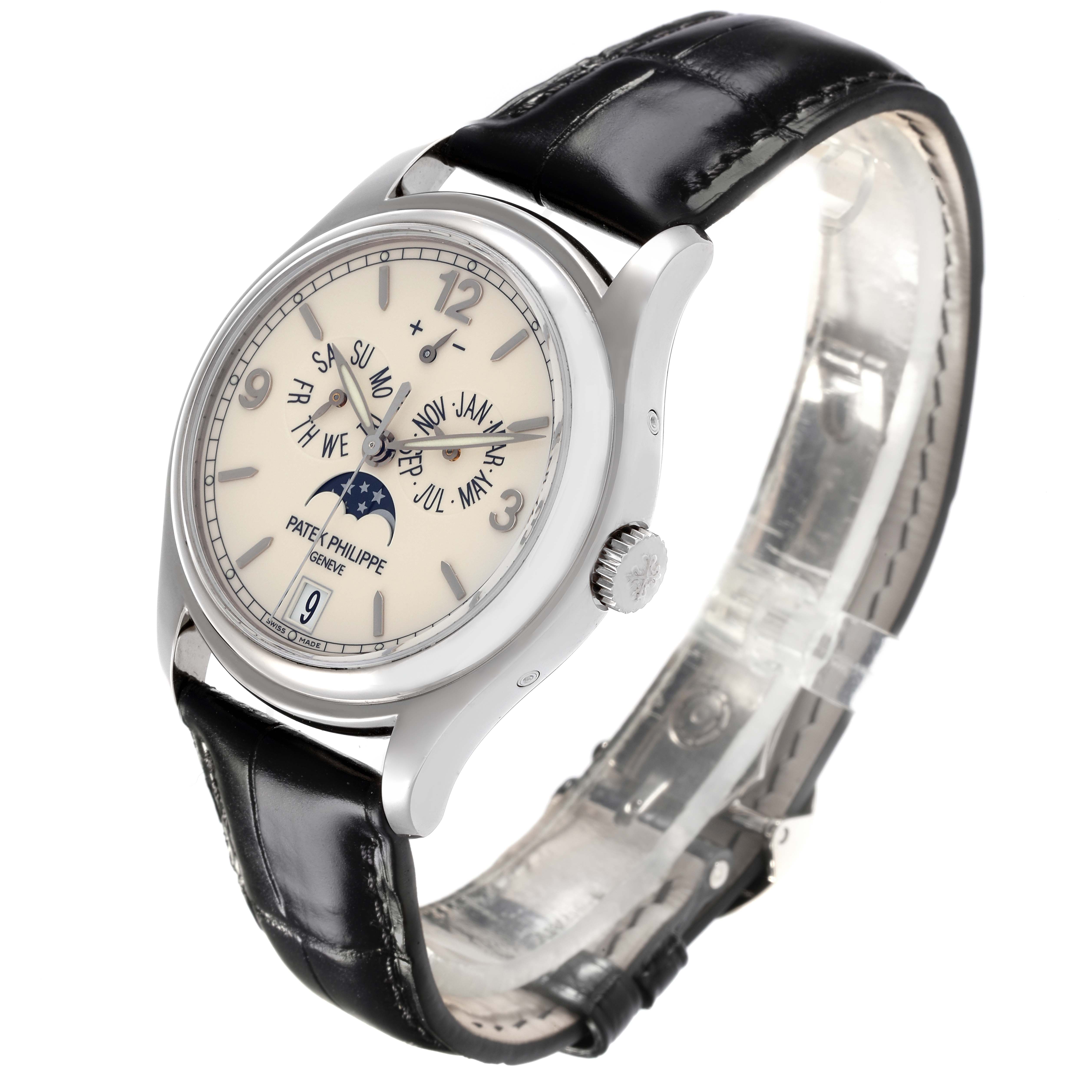 The Patek Philippe Complications 5146G Men
s White Gold White Dial 5146G Men
s White Gold White Dial watch is shown at a three-quarter angle, displaying its face, bezel, crown, and leather strap.