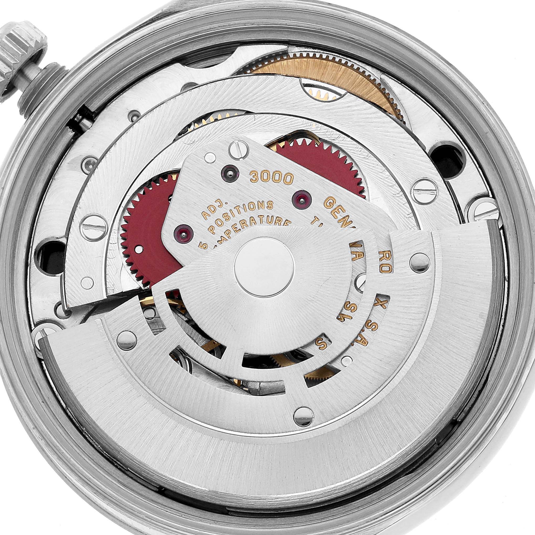 The image shows the internal movement of a Rolex Air-King 14000 Men's Stainless Steel Black Dial watch at a close-up angle, highlighting gears and mechanical components.