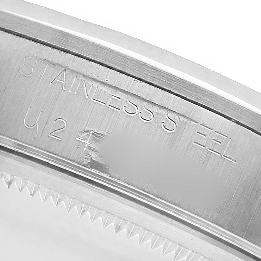 The image shows a close-up of the Rolex Air-King 14000 Men's Stainless Steel Black Dial's stainless steel bezel with engraved text.