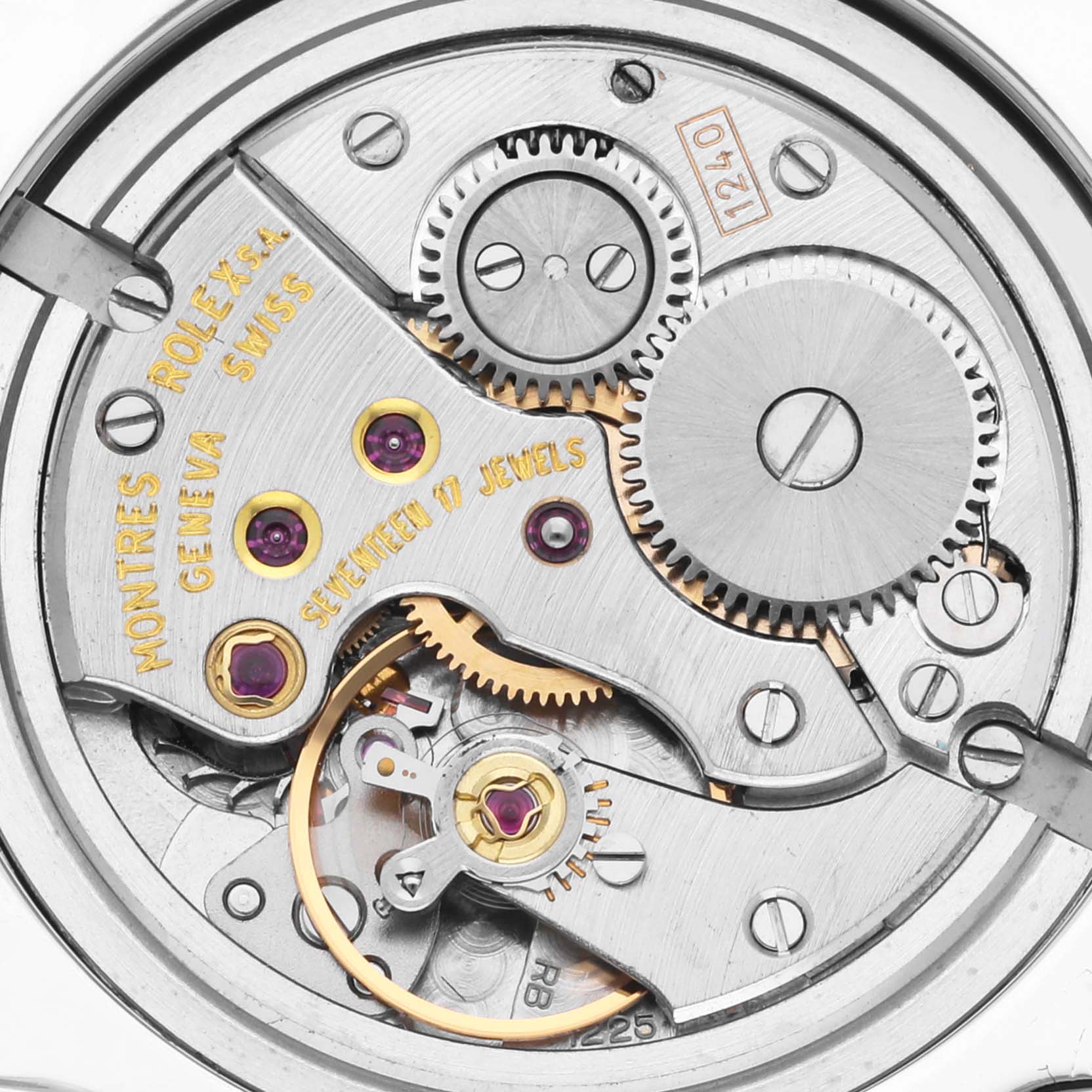 The image shows the internal mechanism of a Rolex Cellini 5240/6 Men's Platinum Mother of Pearl Dial 5240/6 Men's Platinum Mother of Pearl Dial, highlighting gears and jewels from a top-down angle.