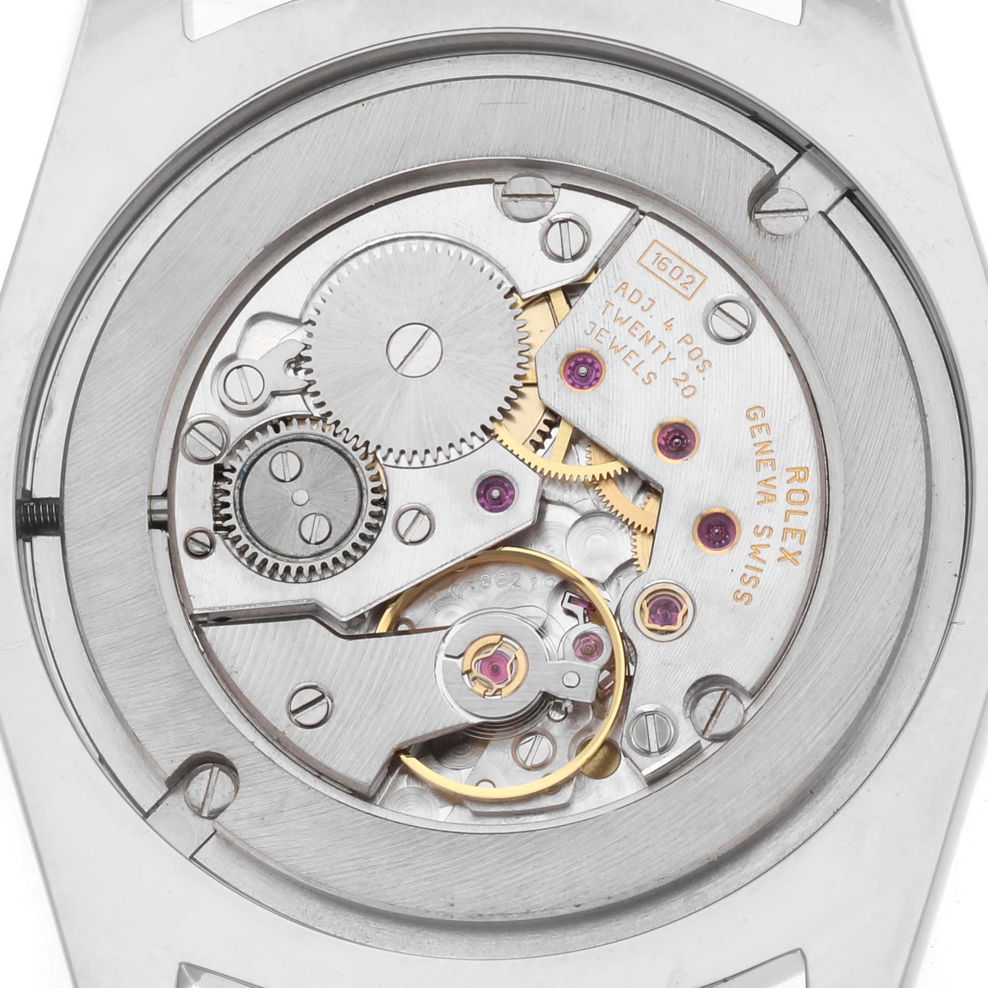 The image shows the movement of a Rolex Cellini 4233 Men's White Gold Black Dial watch from a rear angle, highlighting gears and jewels.