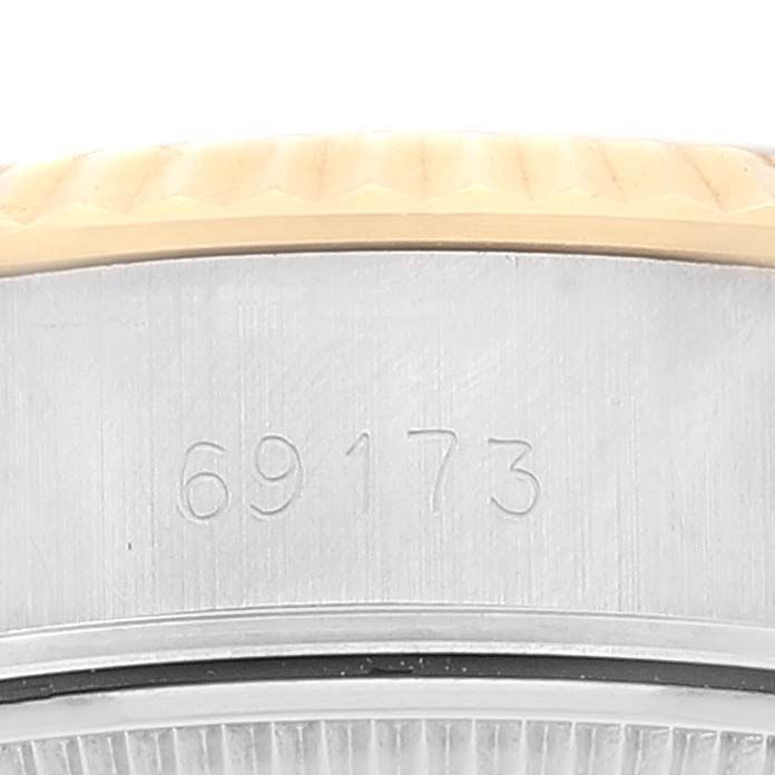 This close-up image shows the engraved model number "69173" on the Rolex Datejust 69173 Women's Steel and Gold (two tone) Champagne Dial 69173 Women's Steel and Gold (two tone) Champagne Dial watch case.