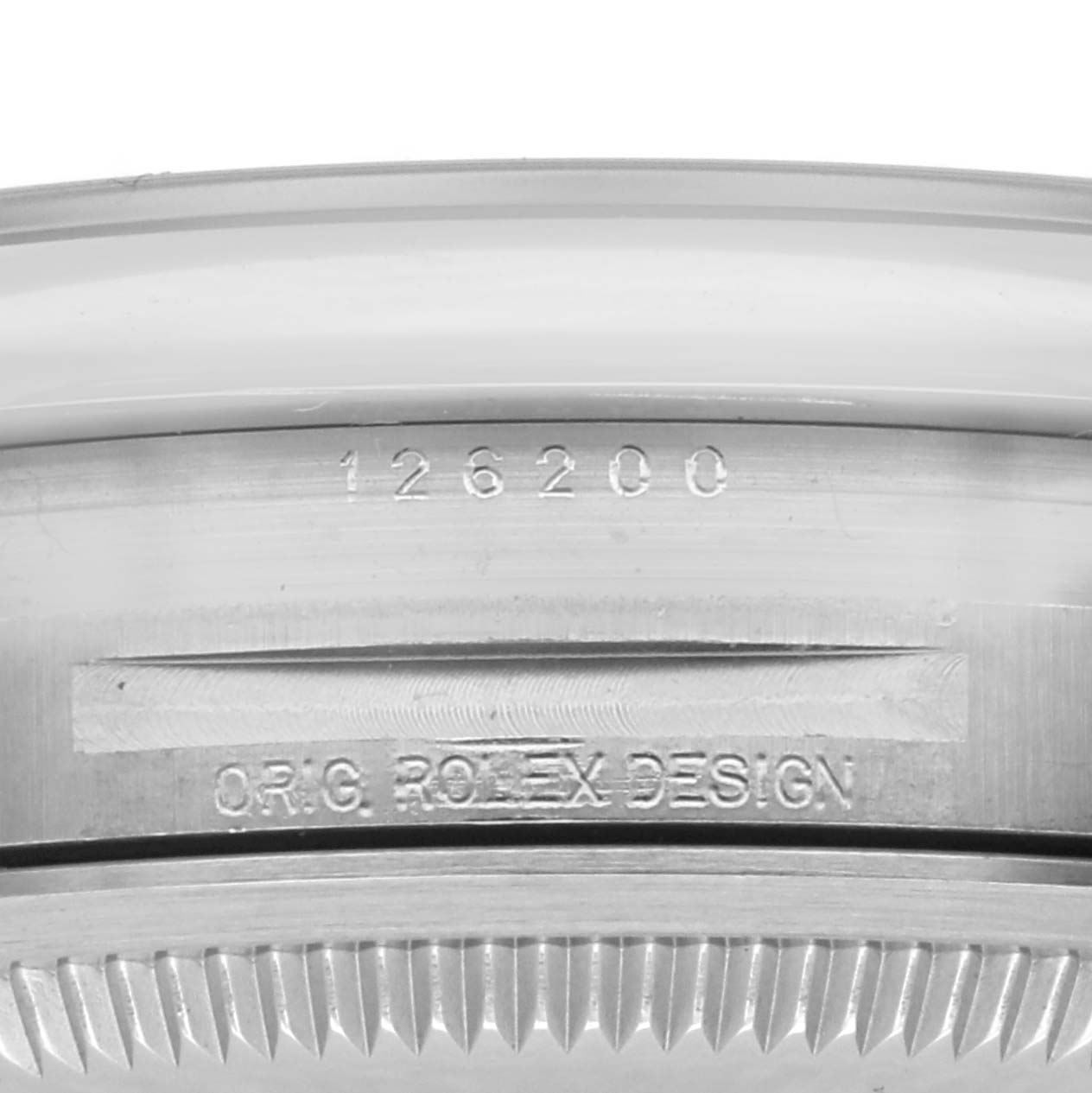 The image shows a close-up of the side case with engraving on a Rolex Datejust 126200 Men
s Stainless Steel Black Dial 126200 Men
s Stainless Steel Black Dial watch.