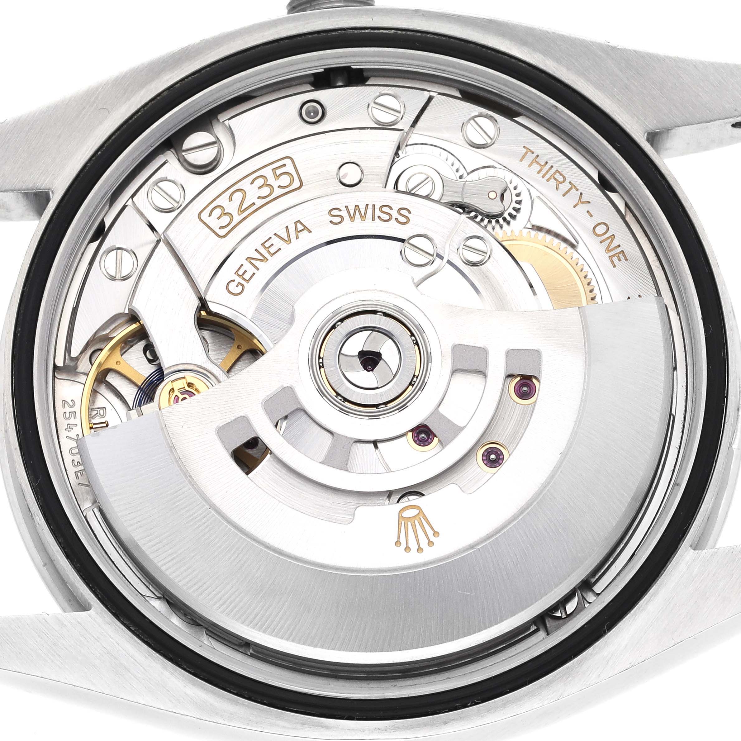 The image shows a close-up of the Rolex Datejust 126200 Men
s Stainless Steel Black Dial 126200 Men
s Stainless Steel Black Dial mechanism from the back, highlighting the movement components.