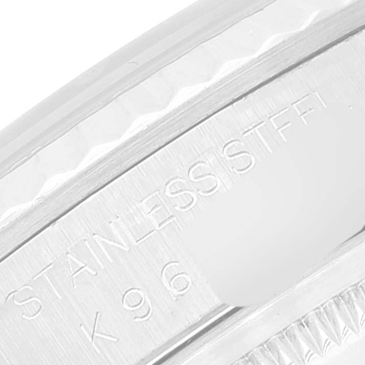 This is a close-up image of the bezel and part of the case of a Rolex Datejust 16234 Men's Stainless Steel Black Dial 16234 Men's Stainless Steel Black Dial watch, highlighting the "STAINLESS STEEL" engraving.