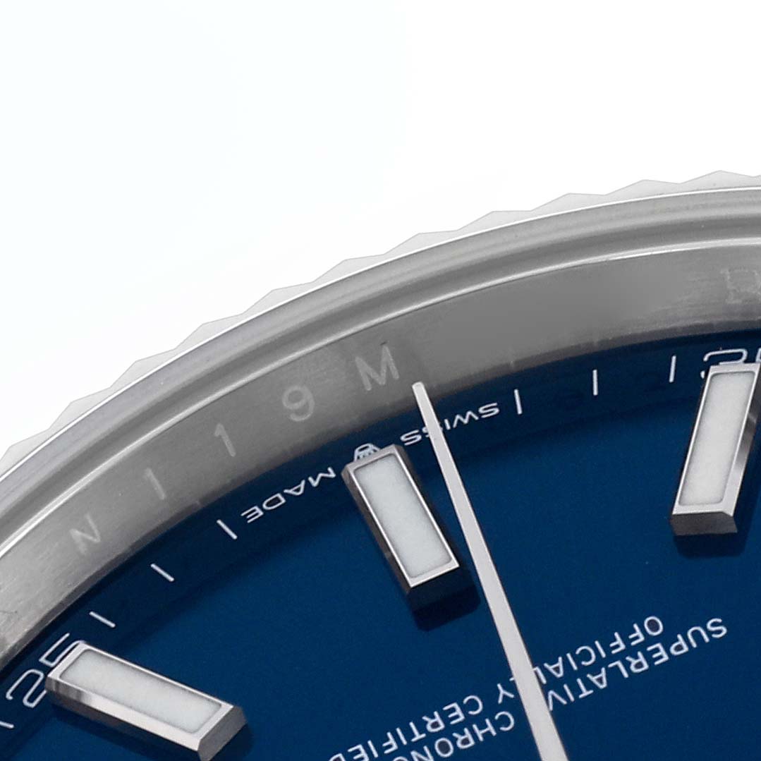The image shows a partial view of the dial, bezel, and markers of a Rolex Datejust 41 126334 Men's Stainless Steel Blue Dial 126334 Men's Stainless Steel Blue Dial watch at an oblique angle.