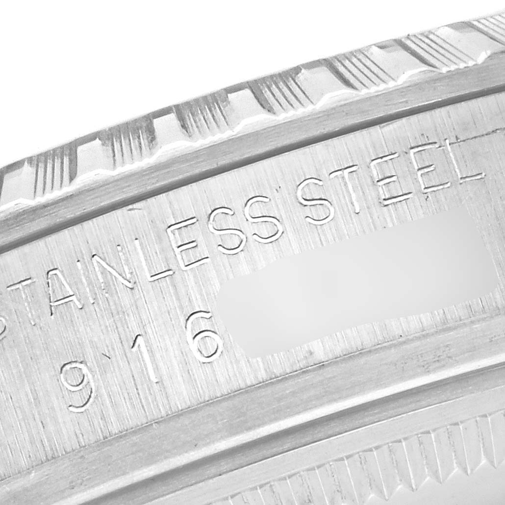 The image shows a close-up of the engraved stainless steel bezel of the Rolex Vintage Collection 16030 Men's Stainless Steel Silver Dial 16030 Men's Stainless Steel Silver Dial watch.