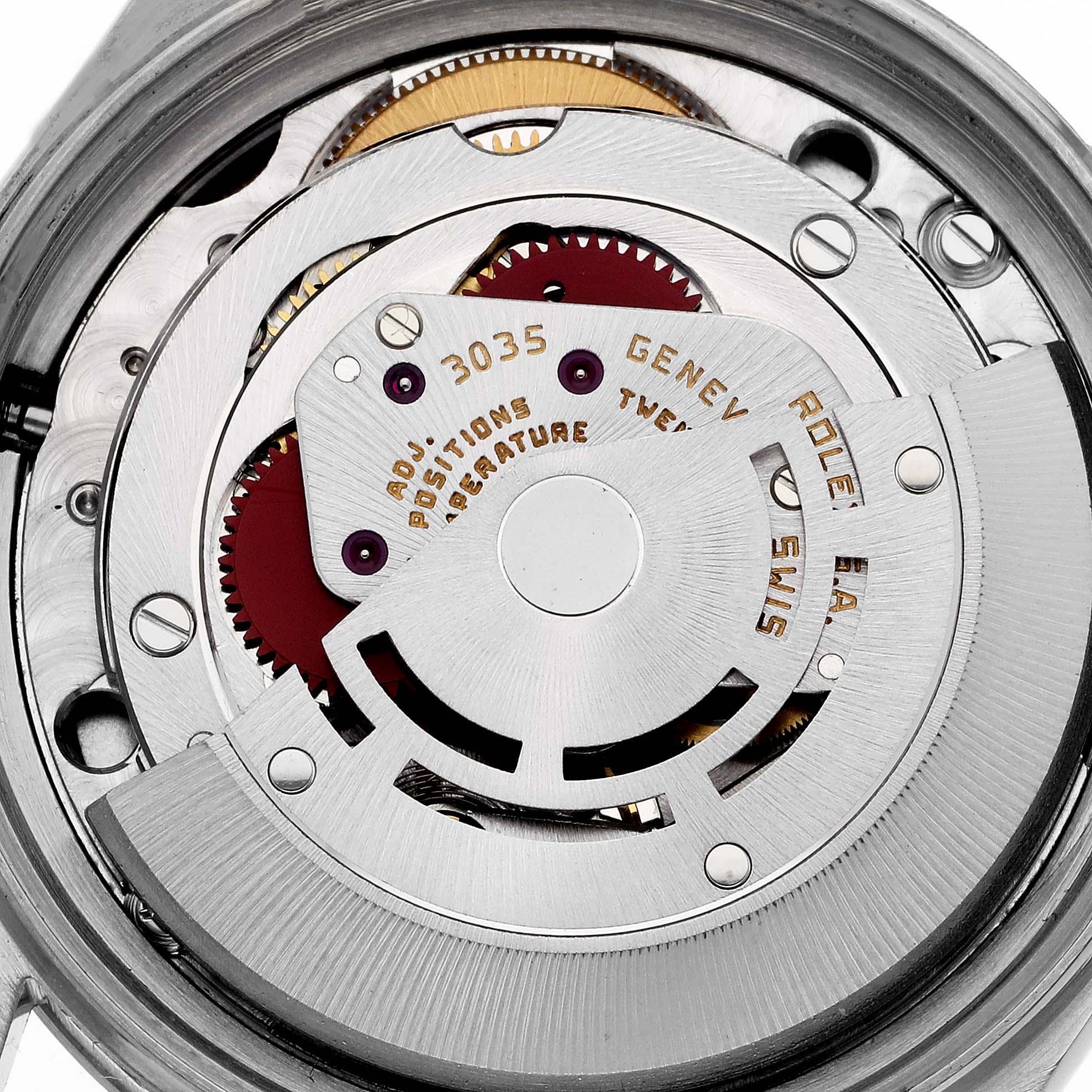 The image shows the intricate internal mechanism of the Rolex Vintage Collection 16030 Men's Stainless Steel Silver Dial 16030 Men's Stainless Steel Silver Dial watch, highlighting gears and engravings.