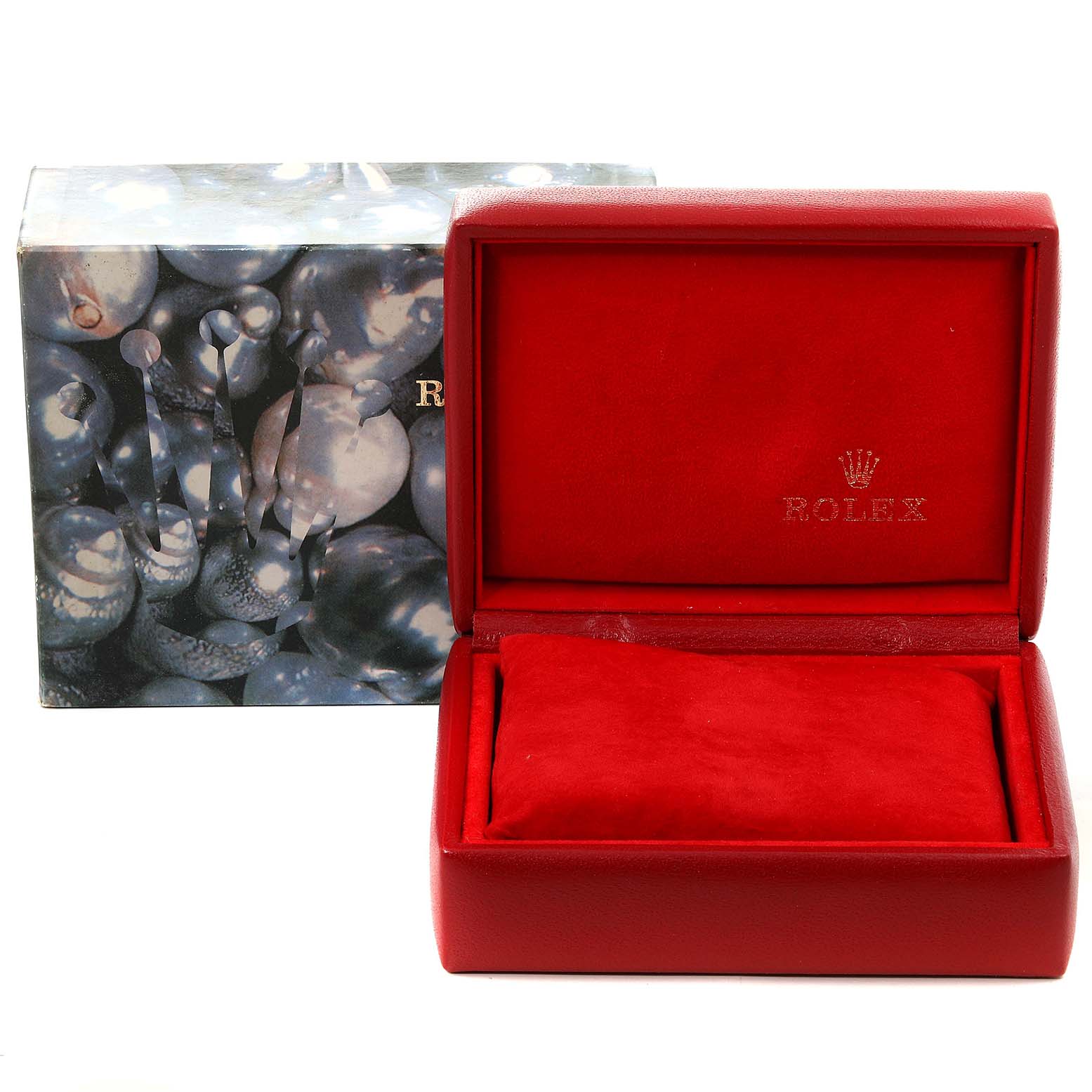 The image shows a red Rolex Datejust 69174 Women's Stainless Steel Pink Dial 69174 Women's Stainless Steel Pink Dial watch box, open with a cushion inside, placed beside an outer box with a decorative design.