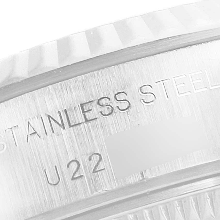 This is a close-up of the case back edge of a Rolex Datejust 69174 Women's Stainless Steel Pink Dial 69174 Women's Stainless Steel Pink Dial watch, showing "STAINLESS STEEL" and a portion of the model or serial number.
