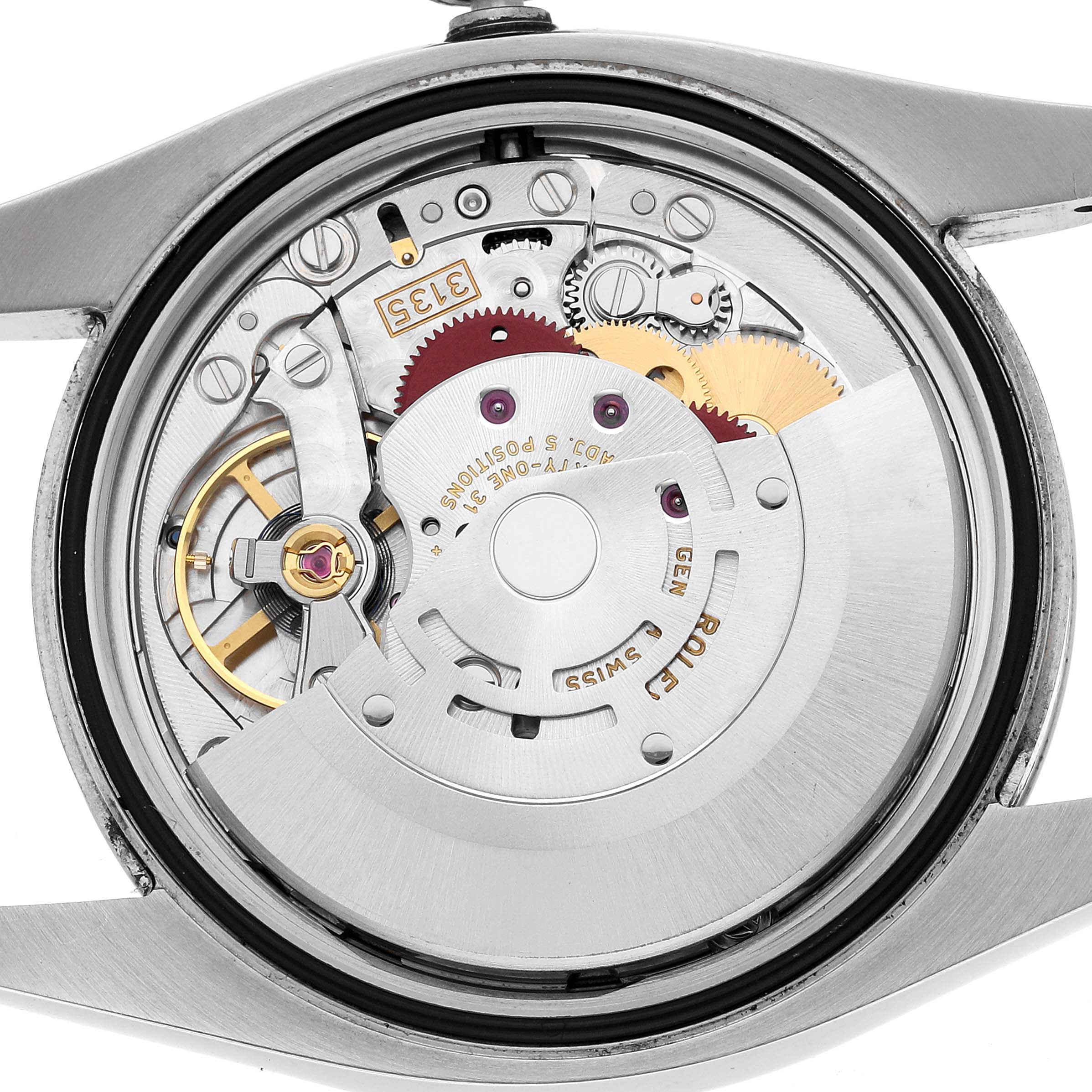 The image shows the automatic movement mechanism of a Rolex Datejust 116200 Men's Stainless Steel Black Dial from a rear angle.