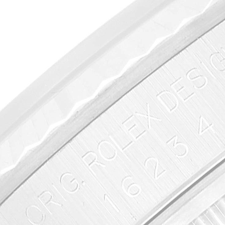 This close-up image shows the engraved side of a Rolex Datejust 16234 Men's Stainless Steel Mother of Pearl Dial 16234 Men's Stainless Steel Mother of Pearl Dial watch's bezel.