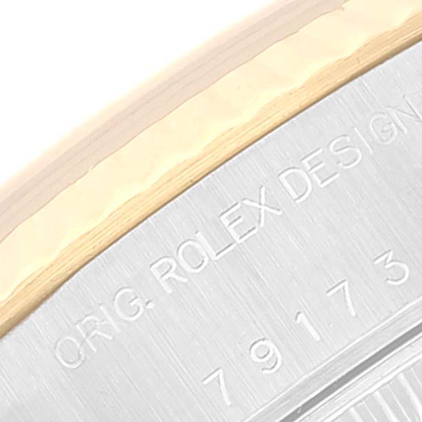 The image shows a close-up of the case back with engraving of a Rolex Datejust 79173 Women's Steel and Gold (two tone) Black Dial 79173 Women's Steel and Gold (two tone) Black Dial watch.
