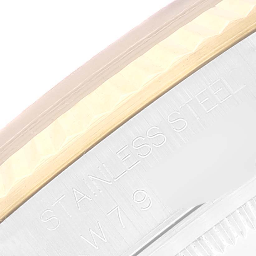 This close-up image of the Rolex Datejust 16233 Men's Steel and Gold (two tone) Blue Dial 16233 Men's Steel and Gold (two tone) Blue Dial model shows part of the case back and the engraved stainless steel lettering.