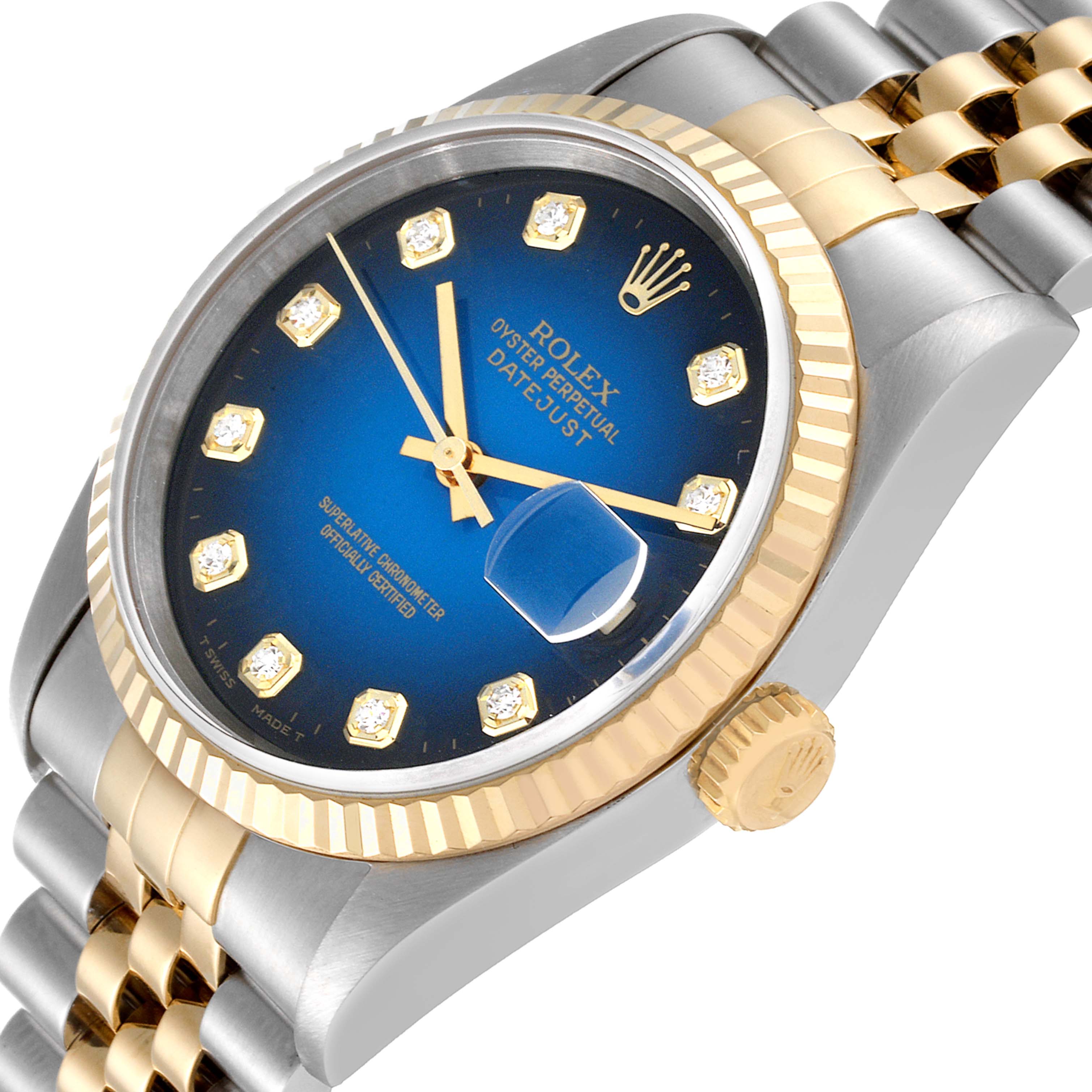 This image shows a close-up angle of the Rolex Datejust 16233 Men's Steel and Gold (two tone) Blue Dial 16233 Men's Steel and Gold (two tone) Blue Dial watch, highlighting its blue dial, diamond markers, bezel, crown, and bracelet.