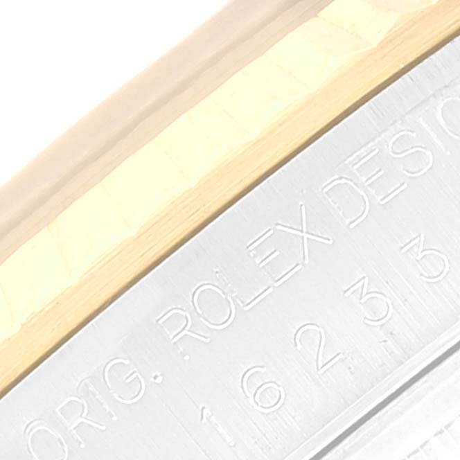 This is a close-up of the side engraving on a Rolex Datejust 16233 Men's Steel and Gold (two tone) Blue Dial 16233 Men's Steel and Gold (two tone) Blue Dial watch bezel.