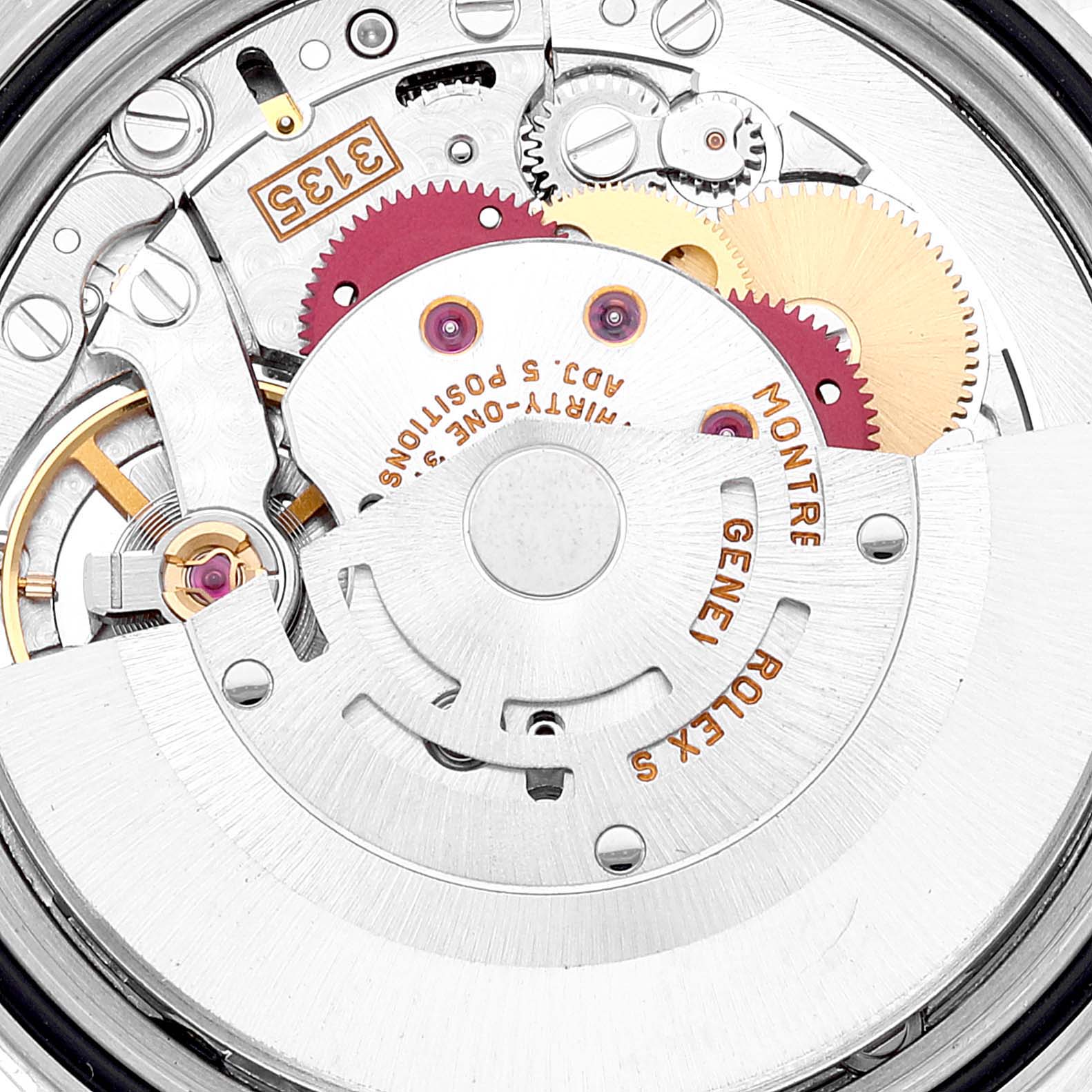 This image shows the movement of a Rolex Datejust 16233 Men's Steel and Gold (two tone) Blue Dial 16233 Men's Steel and Gold (two tone) Blue Dial watch, highlighting gears and intricate mechanical parts from a close-up, top-down angle.